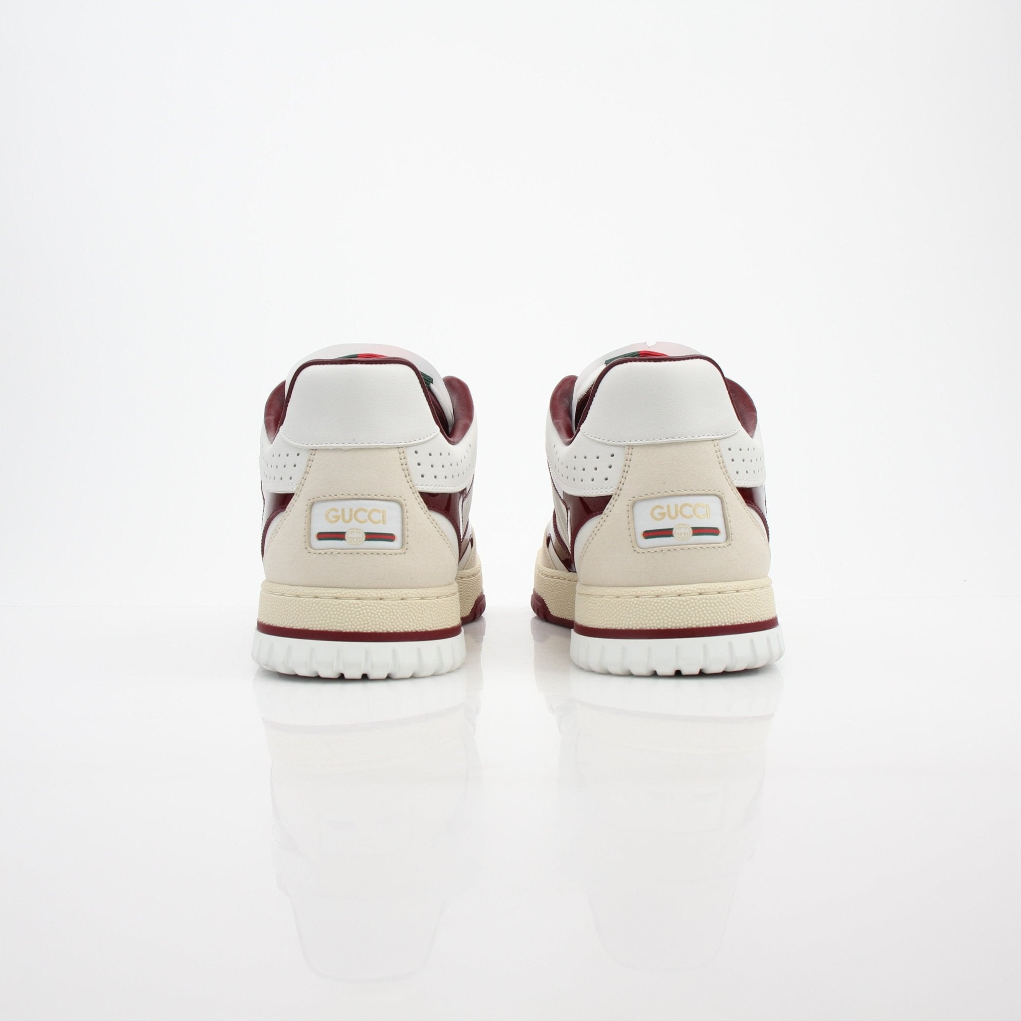 Gucci men's Re-Web low top leather sneakers featuring classic design and stylish details, shown in a close-up view.