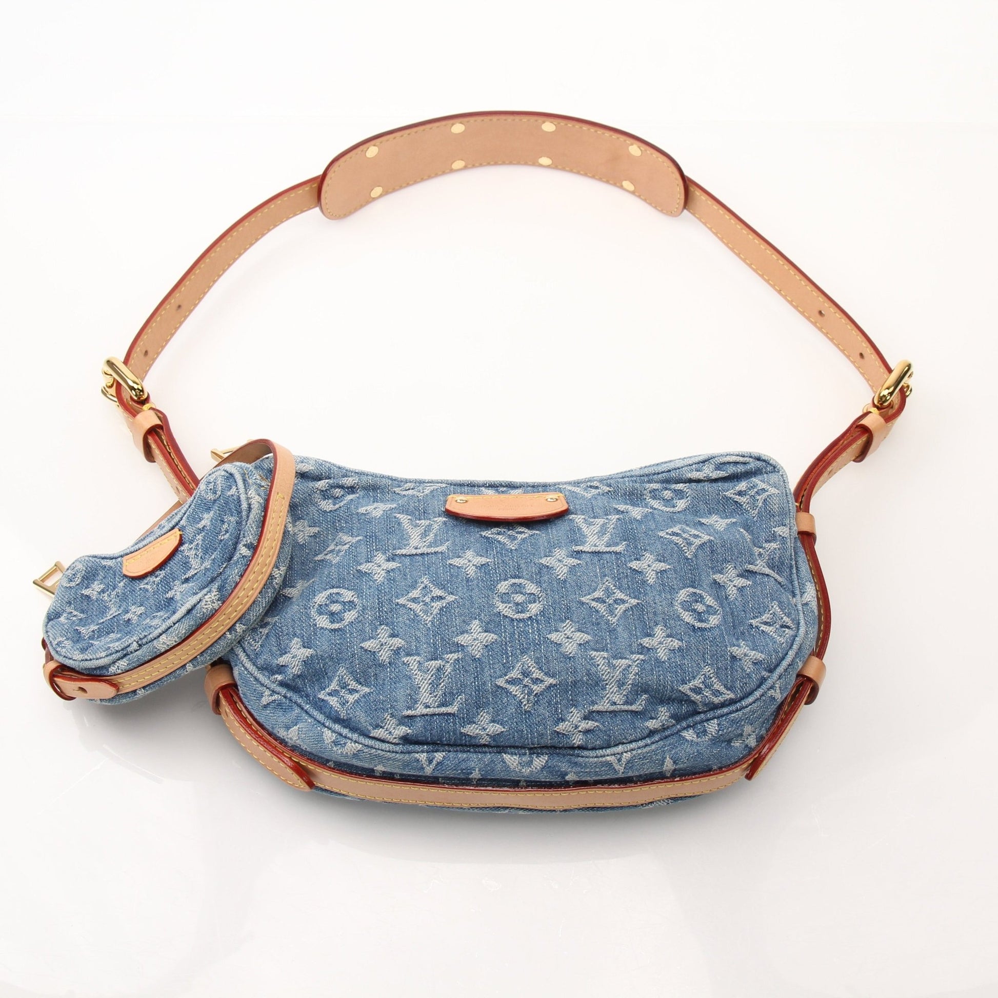 Louis Vuitton Denim Croissant handbag with gold accents, stylish denim material, and compact design for everyday use.