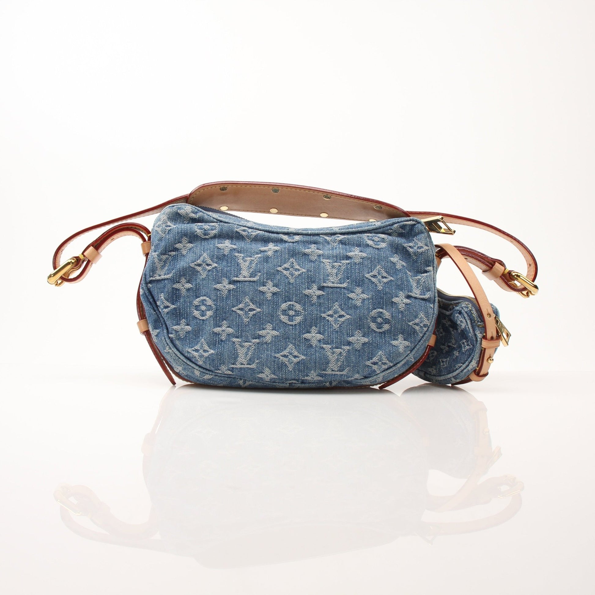 Louis Vuitton Denim Croissant handbag with gold accents and adjustable strap, featuring a stylish, compact design.
