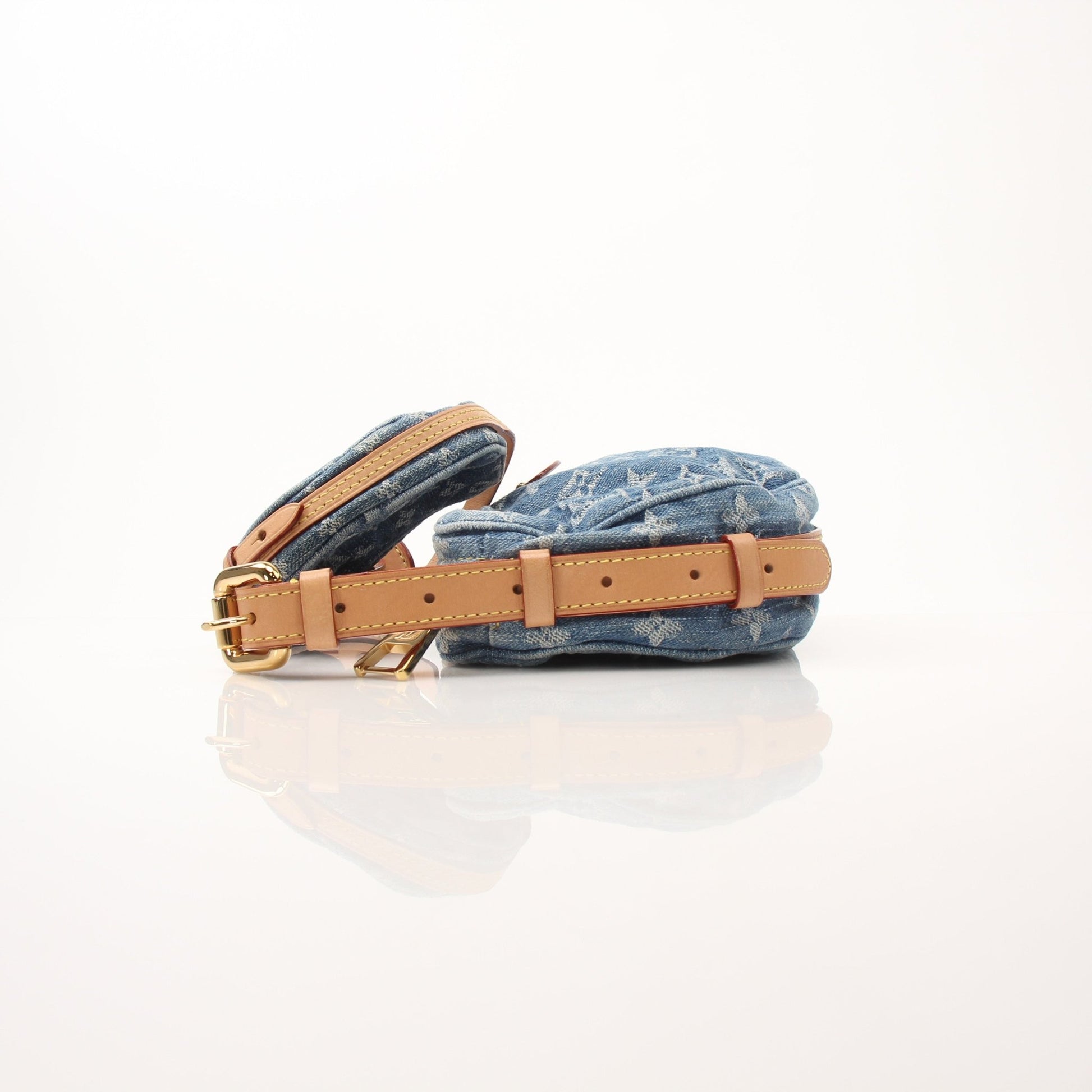 Louis Vuitton Denim Croissant handbag by Gold & Beyond, showing a stylish blue denim handbag with gold accents and top handle.