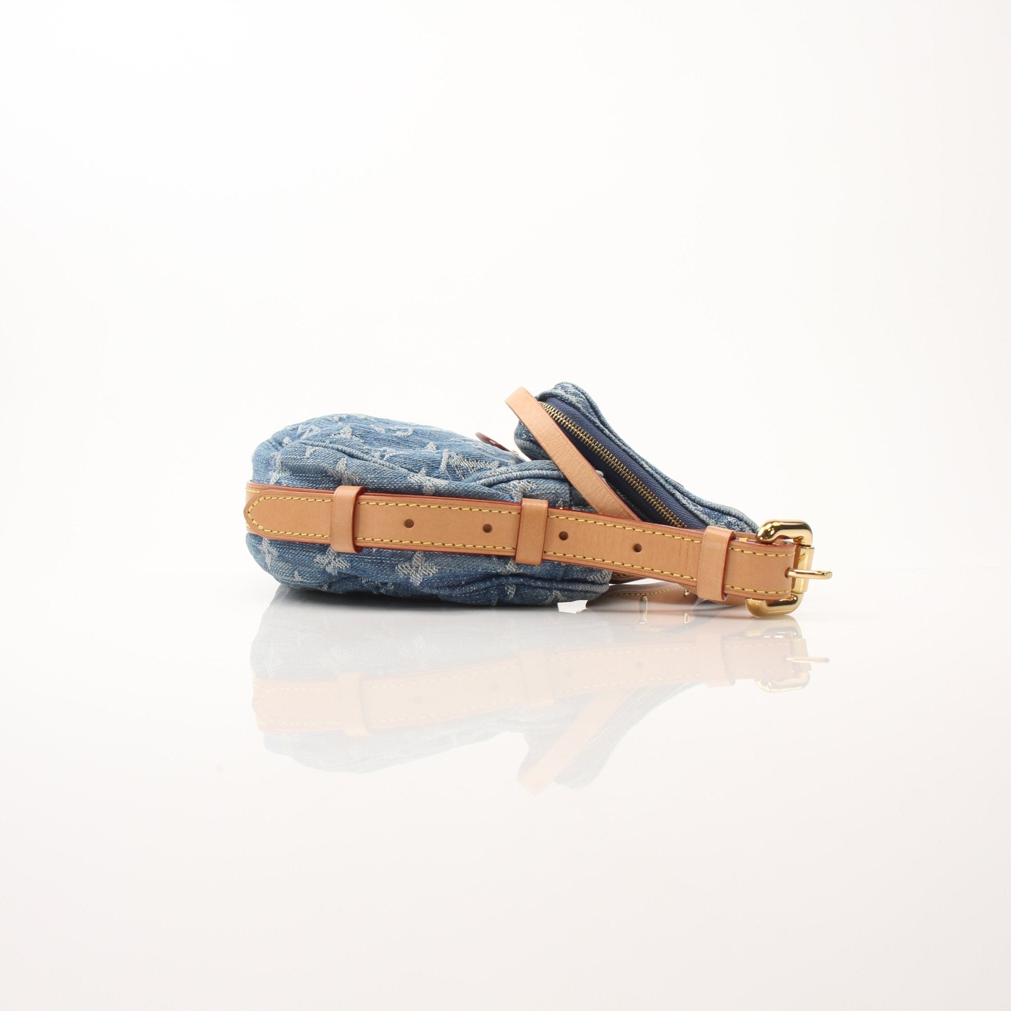 Louis Vuitton denim croissant handbag by Gold & Beyond, showcasing a stylish denim design with gold-tone accents and a compact shape.