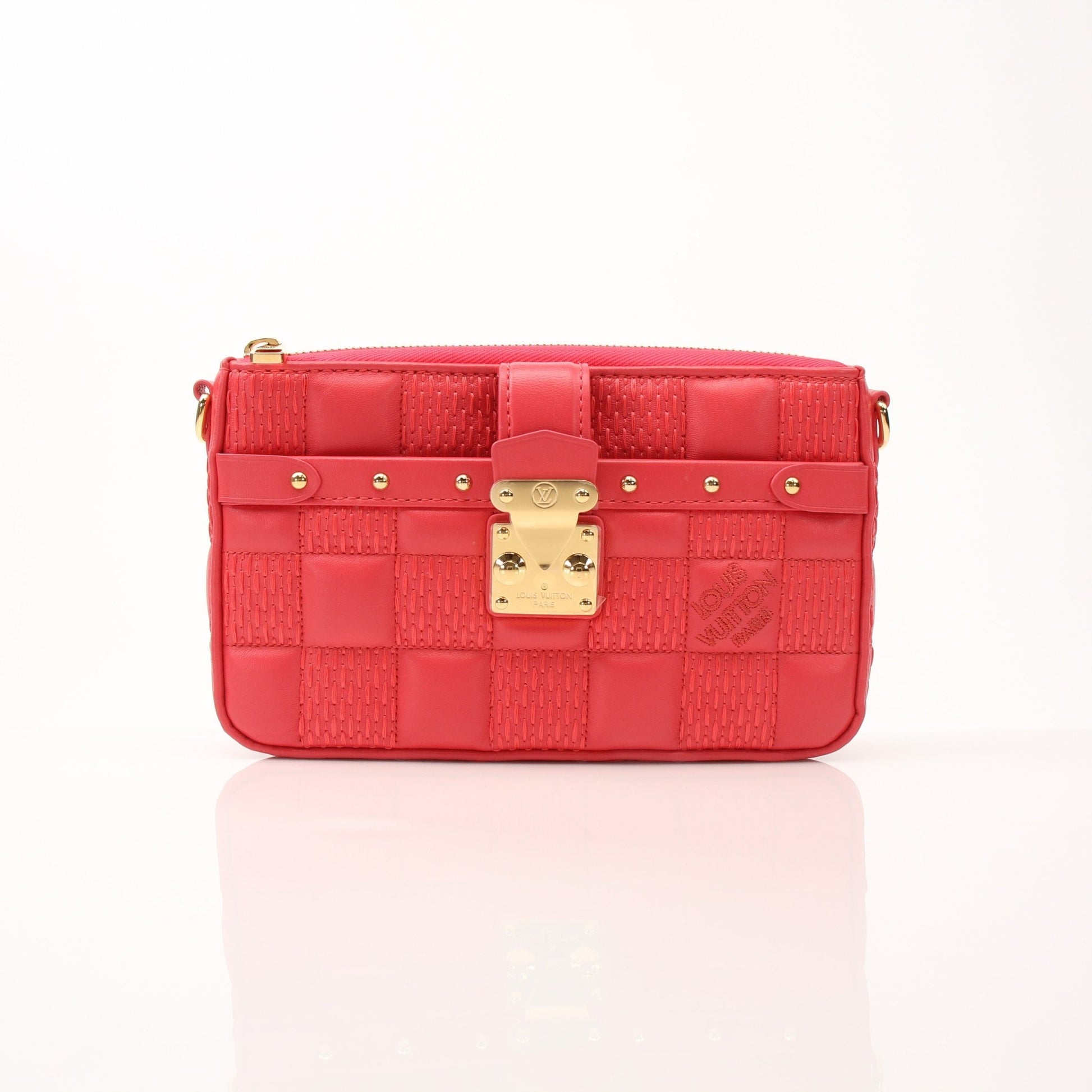 Louis Vuitton Pochette Troca PM handbag by Gold & Beyond, featuring a sleek design and gold accents, displayed against a neutral background.