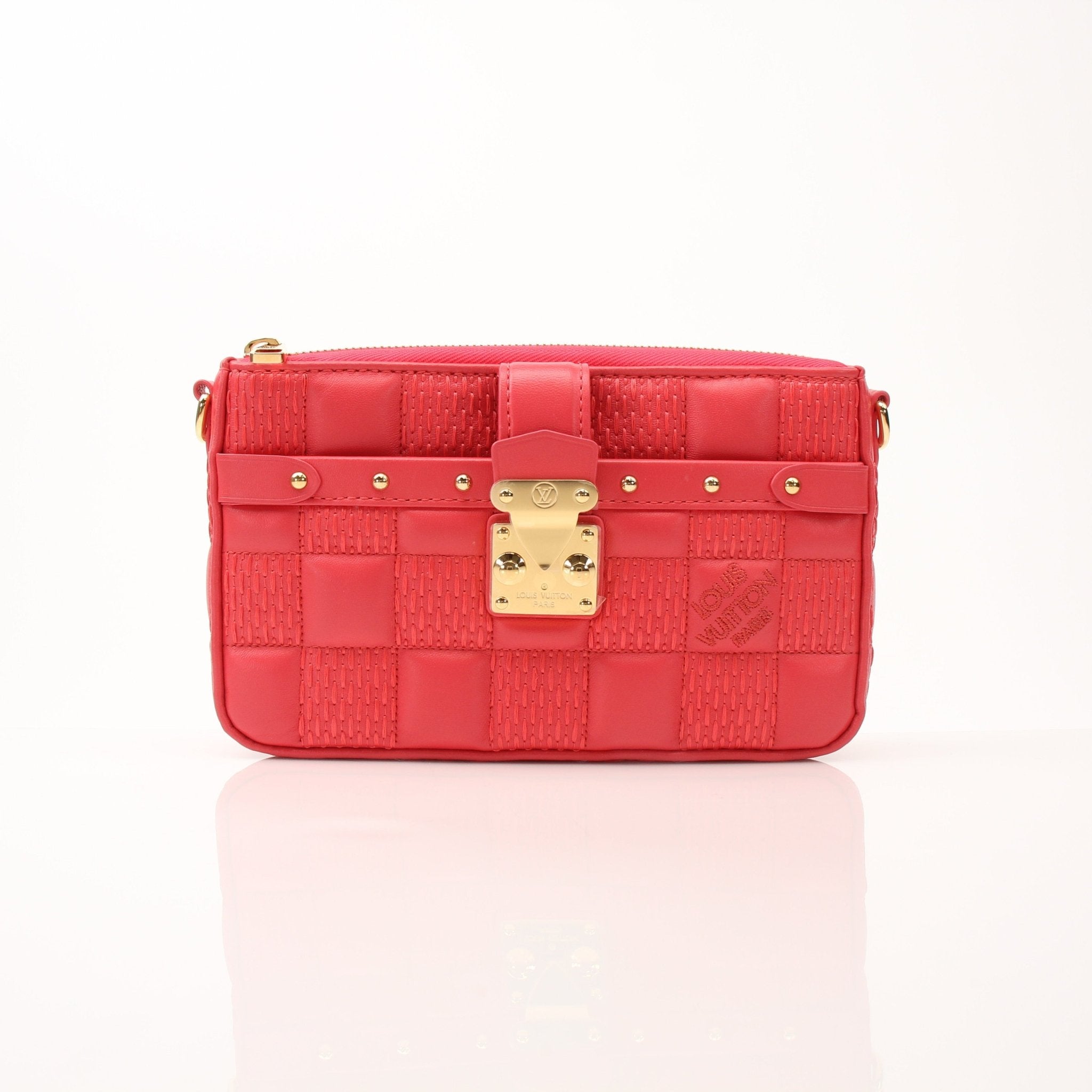 Louis Vuitton Pochette Troca PM handbag in black leather with gold hardware, featuring a compact design and top zipper closure.