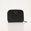 Gold & Beyond Prada zip wallet with sleek design, featuring multiple card slots and a secure zipper closure.