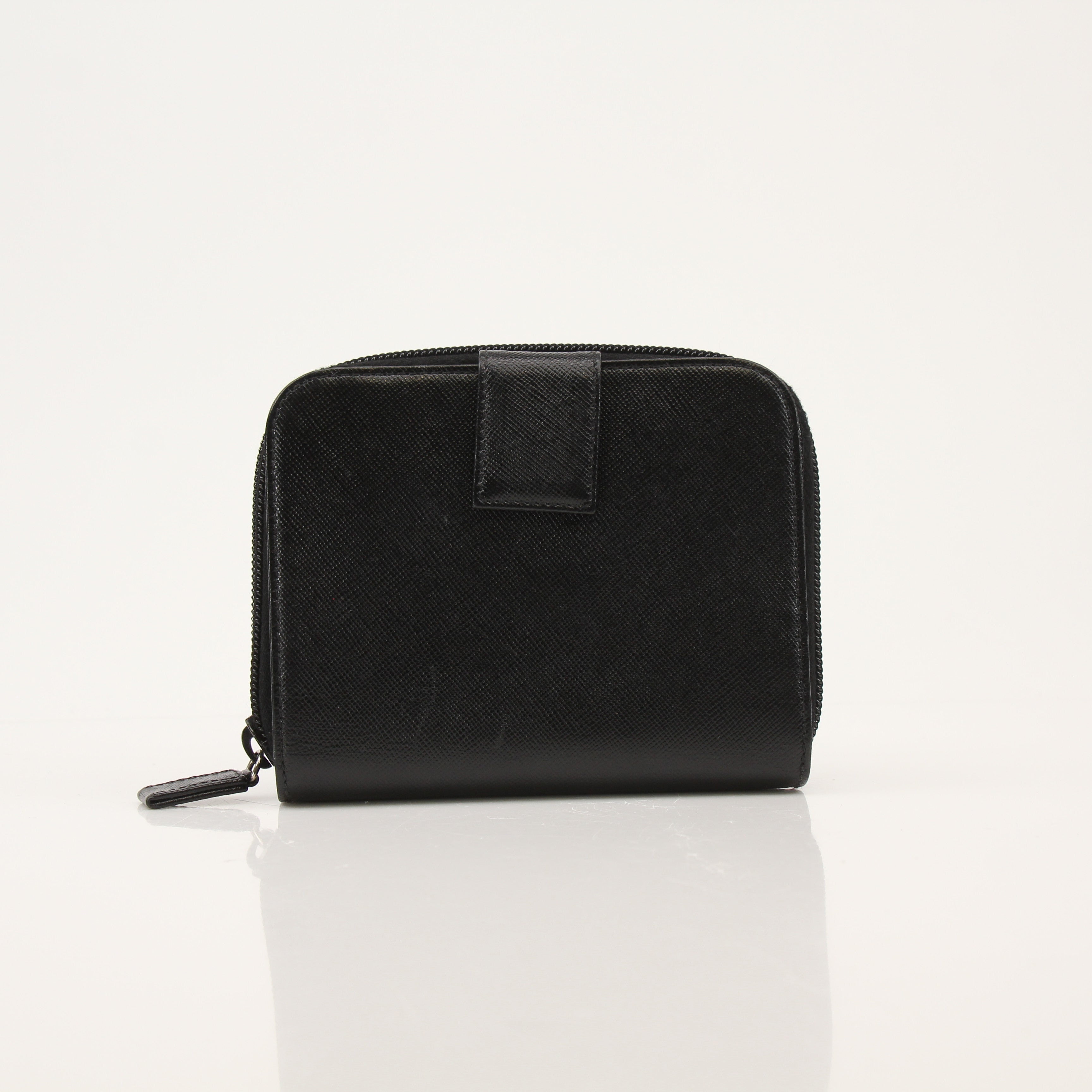 Gold & Beyond Prada zip wallet with leather exterior and metal zipper, showcasing sleek design and compact size.