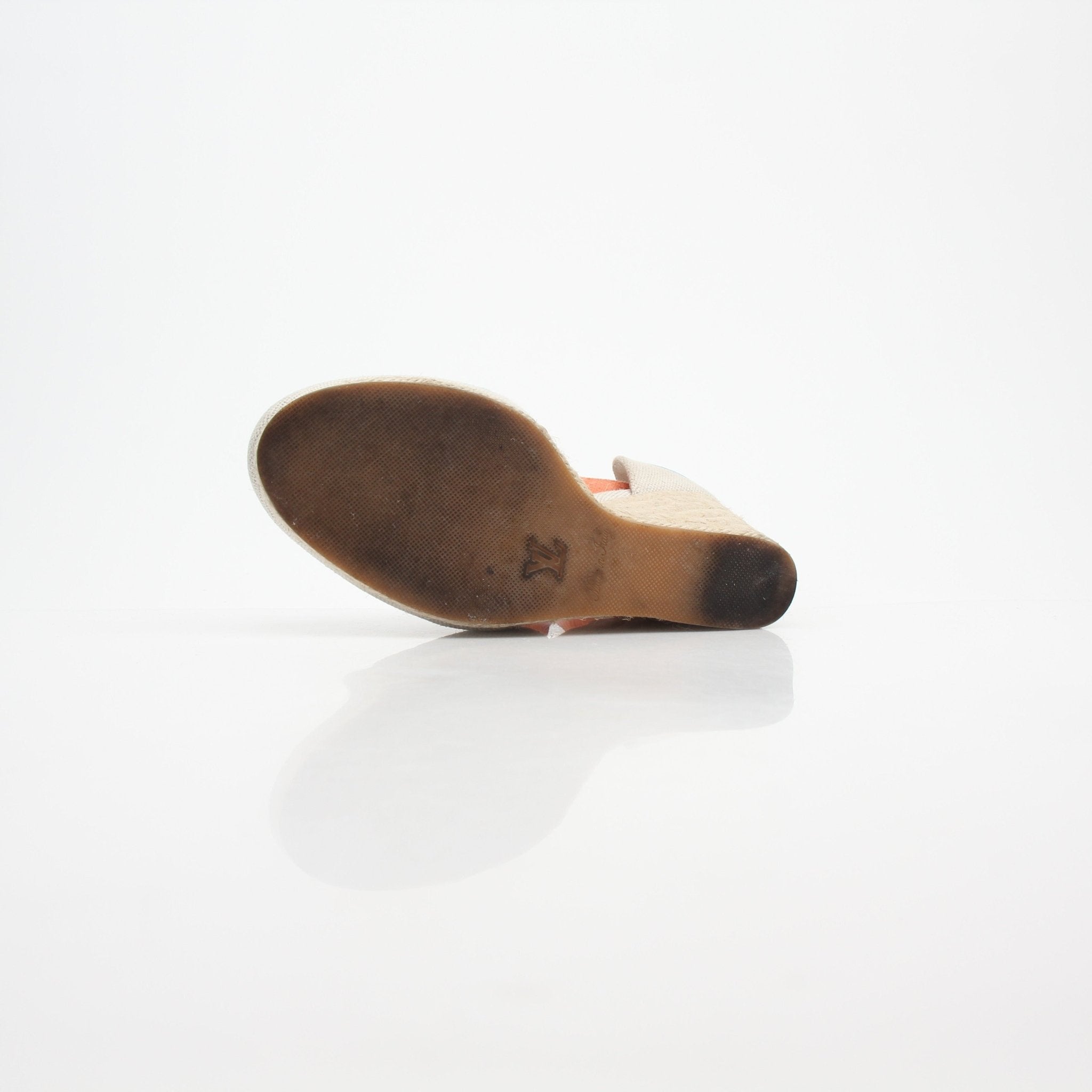 Louis Vuitton women's Monogram Starboard wedge espadrille heels with a natural woven sole and monogram pattern on fabric upper.
