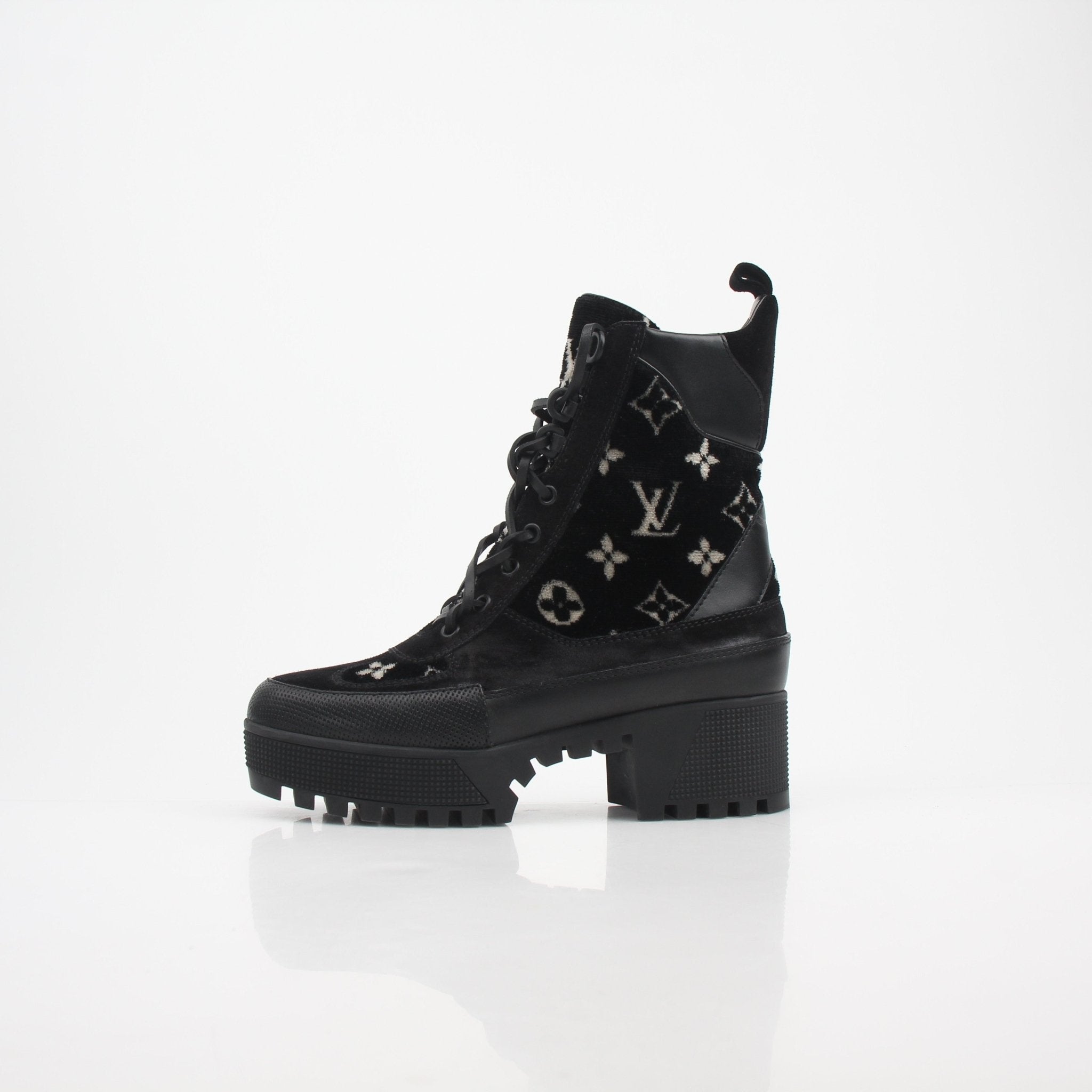 Louis Vuitton women’s Monogram velvet Laureate platform desert boots with chunky soles and gold accents.