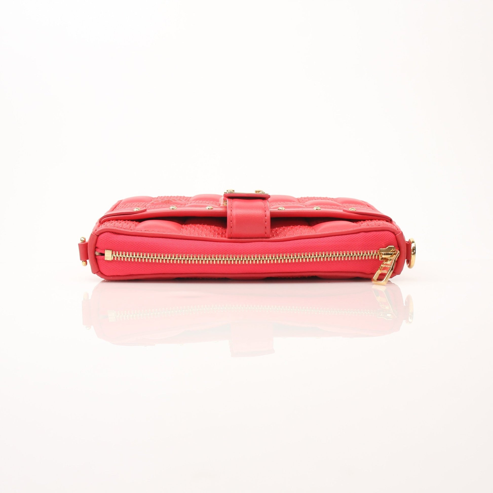 Louis Vuitton Pochette Troca PM handbag by Gold & Beyond, featuring a sleek leather design with gold-tone hardware.