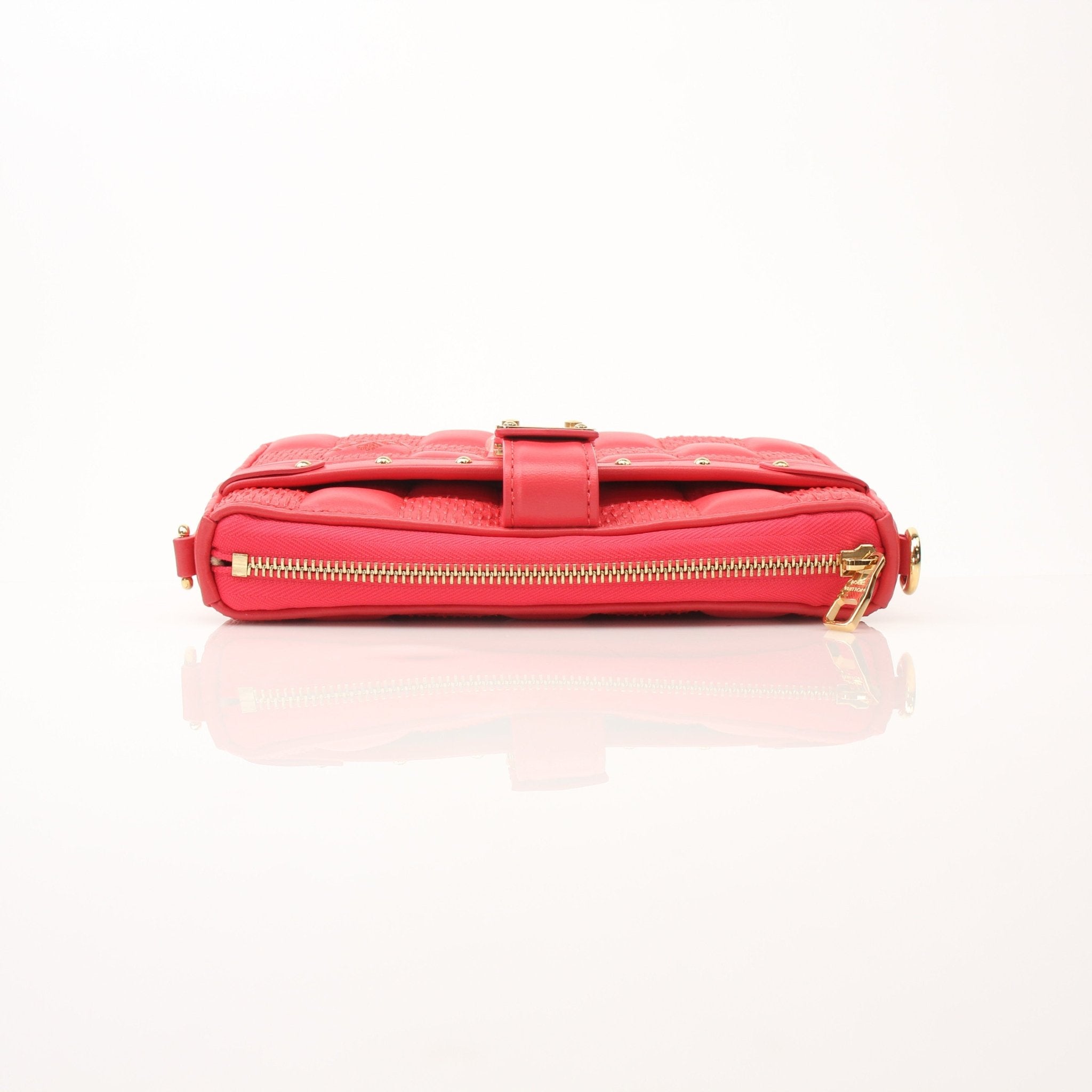 Louis Vuitton Pochette Troca PM handbag by Gold & Beyond, featuring a sleek leather design with gold-tone hardware.