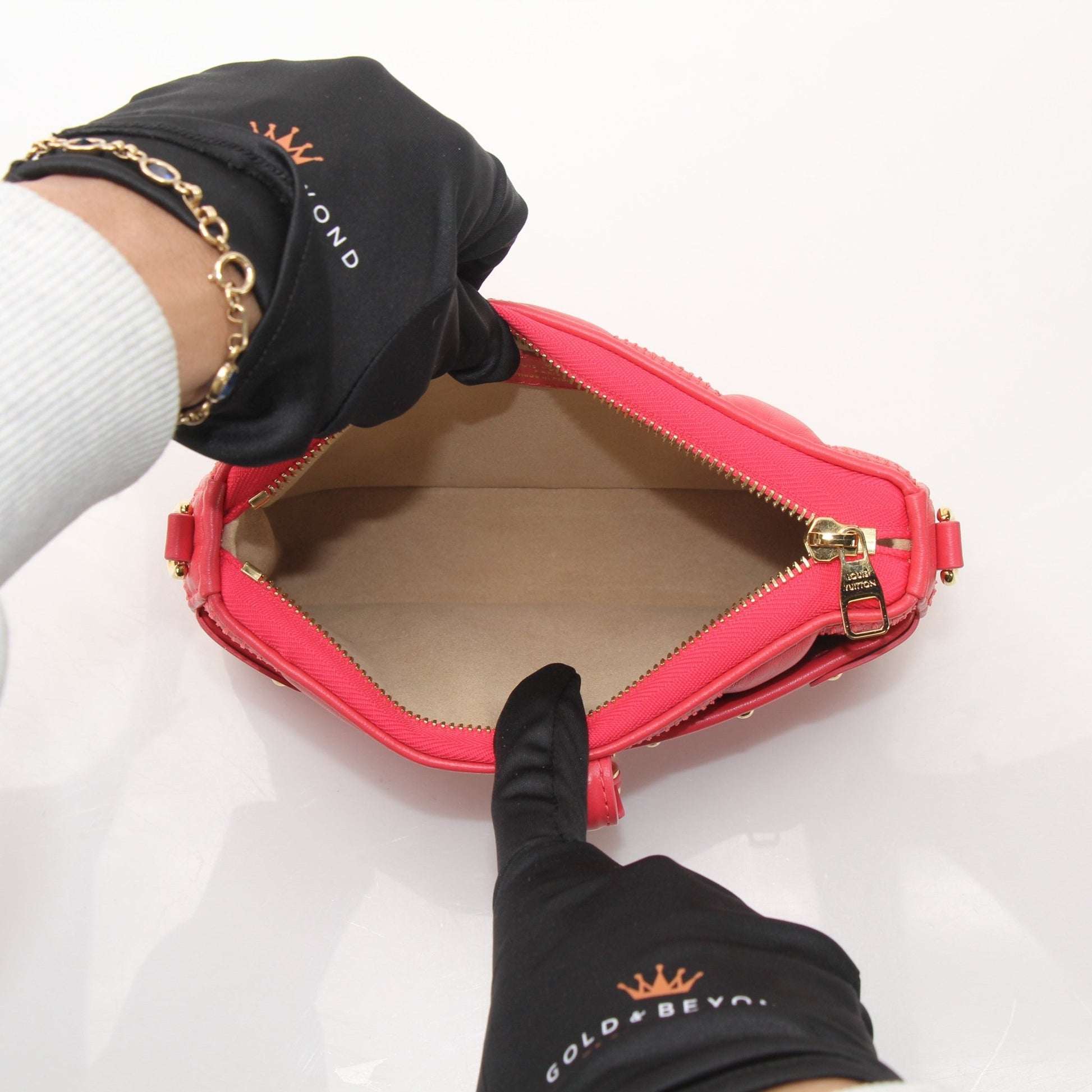 Louis Vuitton Pochette Troca PM handbag with gold-tone hardware and monogram canvas, showcasing a stylish and compact design.