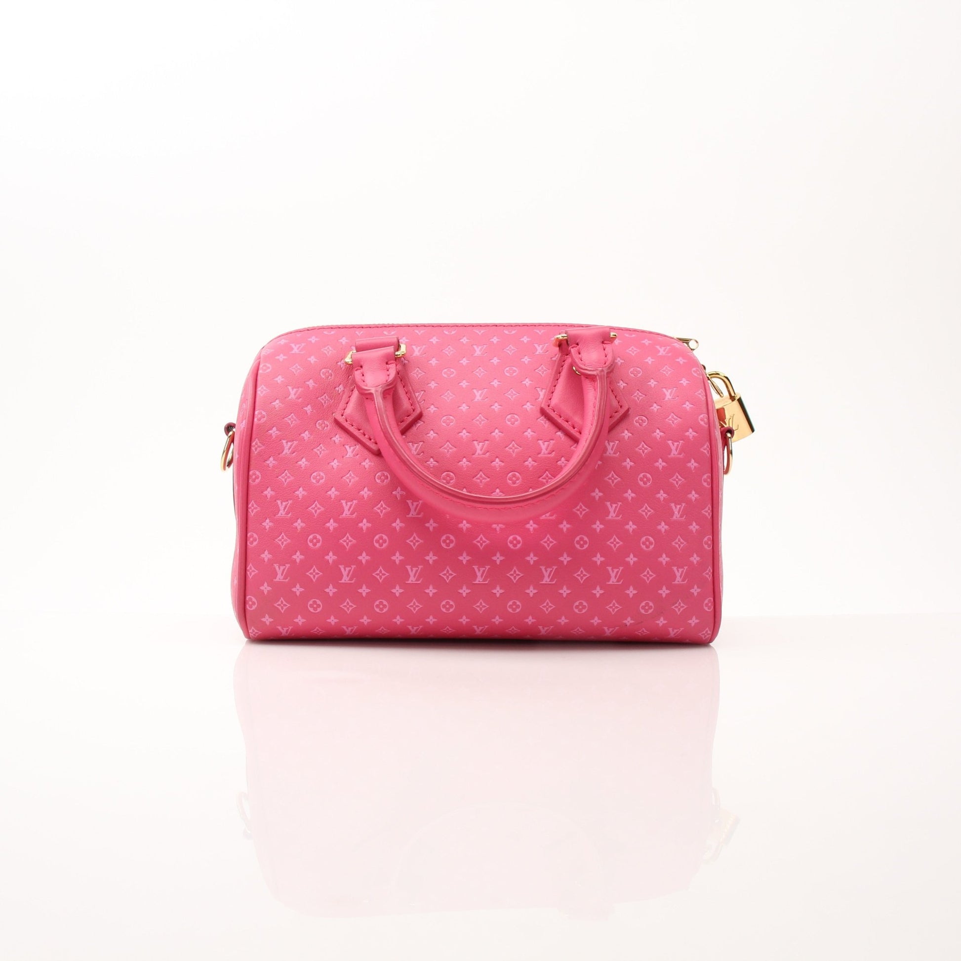 Louis Vuitton Pink Speedy 20 handbag with gold hardware and adjustable bandoulière strap, featuring signature monogram canvas.