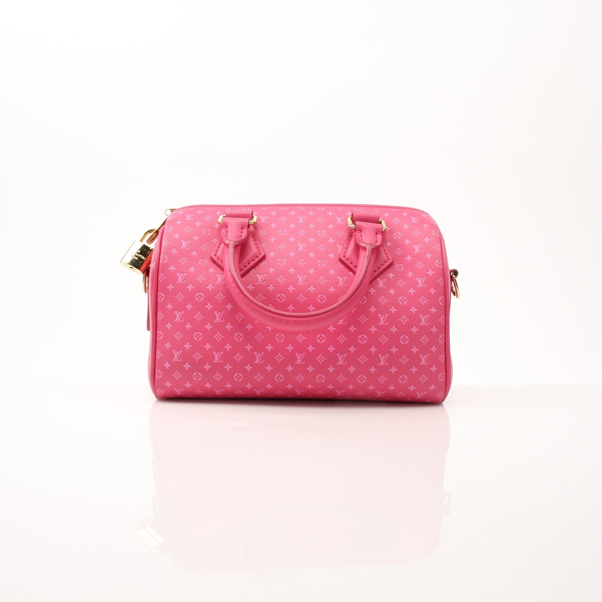 Louis Vuitton pink Speedy 20 handbag with gold hardware, featuring a leather strap and classic monogram design.