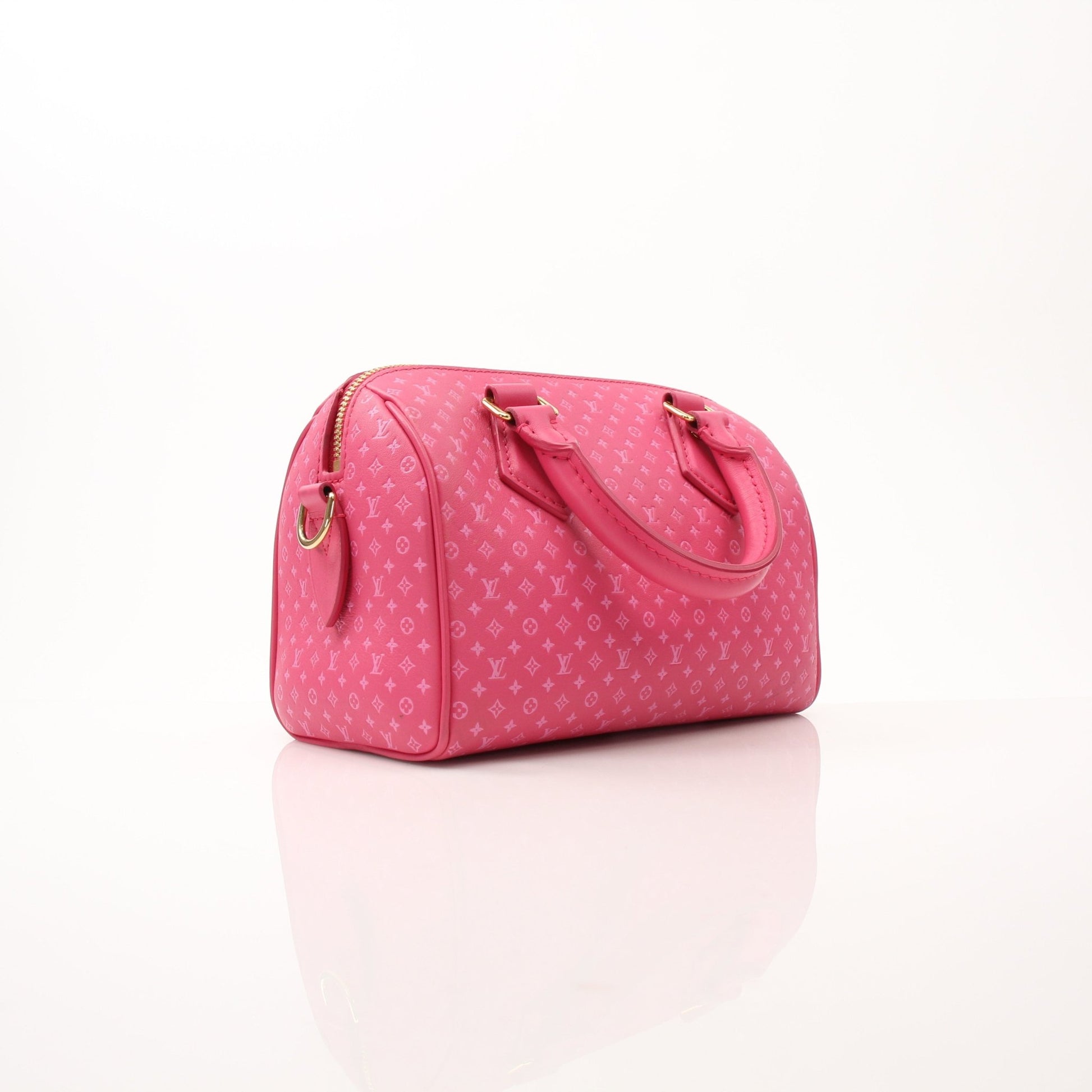 Pink Louis Vuitton Speedy 20 handbag with gold accents and adjustable bandoulière strap, displayed on a neutral background.