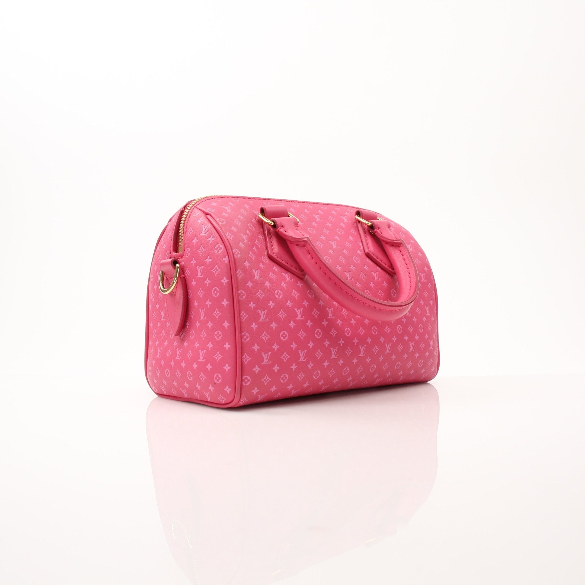 Pink Louis Vuitton Speedy 20 handbag with gold accents and adjustable bandoulière strap, displayed on a neutral background.
