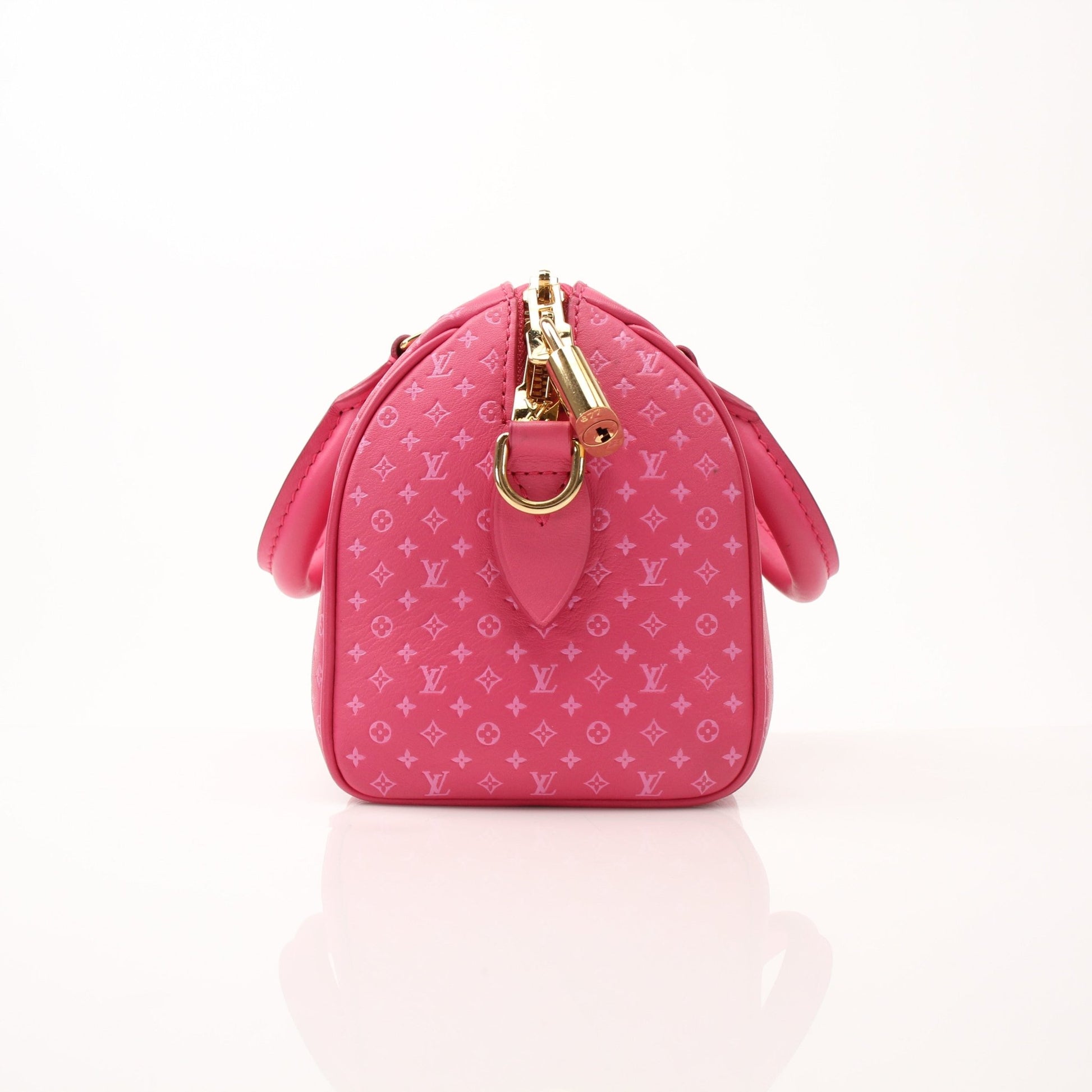 Pink Louis Vuitton Speedy 20 handbag with gold-tone accents and a detachable shoulder strap, displayed on a plain background.