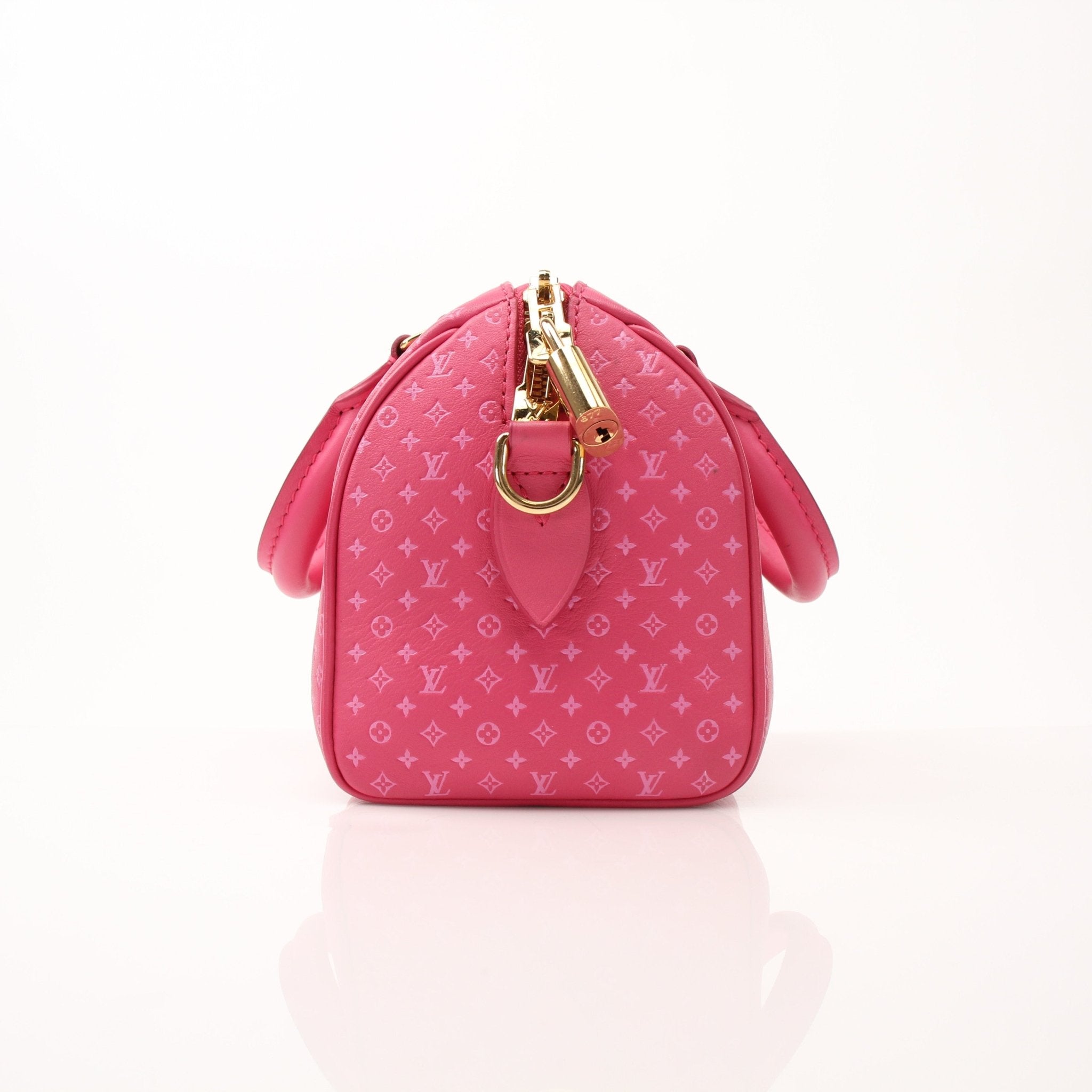 Pink Louis Vuitton Speedy 20 handbag with gold-tone accents and a detachable shoulder strap, displayed on a plain background.