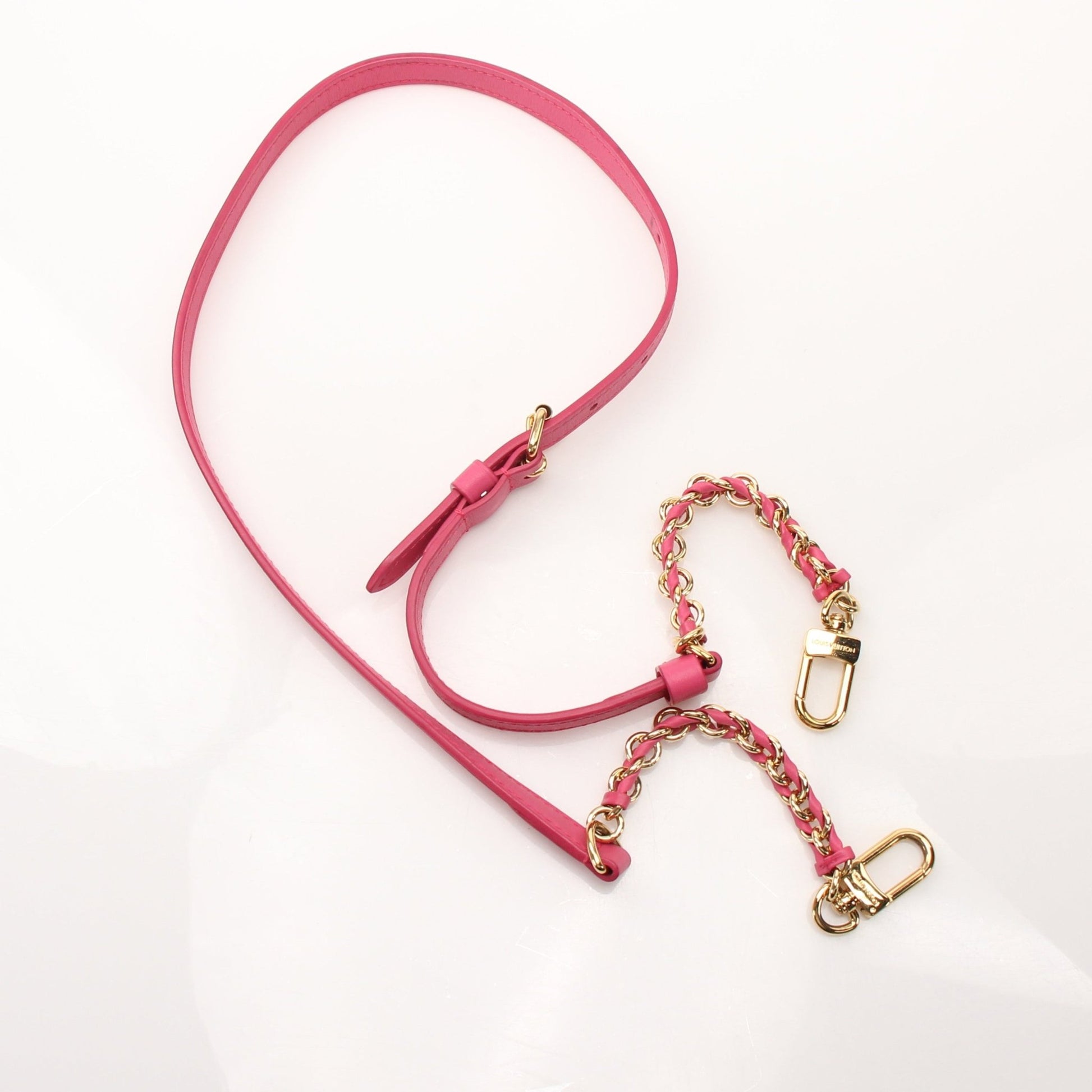 Pink Louis Vuitton Speedy 20 handbag with gold accents, featuring a classic monogram pattern and a detachable shoulder strap.