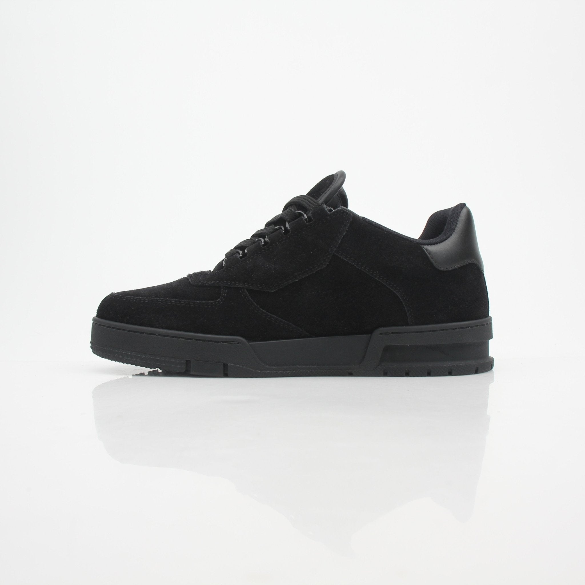 Louis Vuitton Men’s LV Trainer black suede sneakers with white soles, featuring logo details and stylish design.