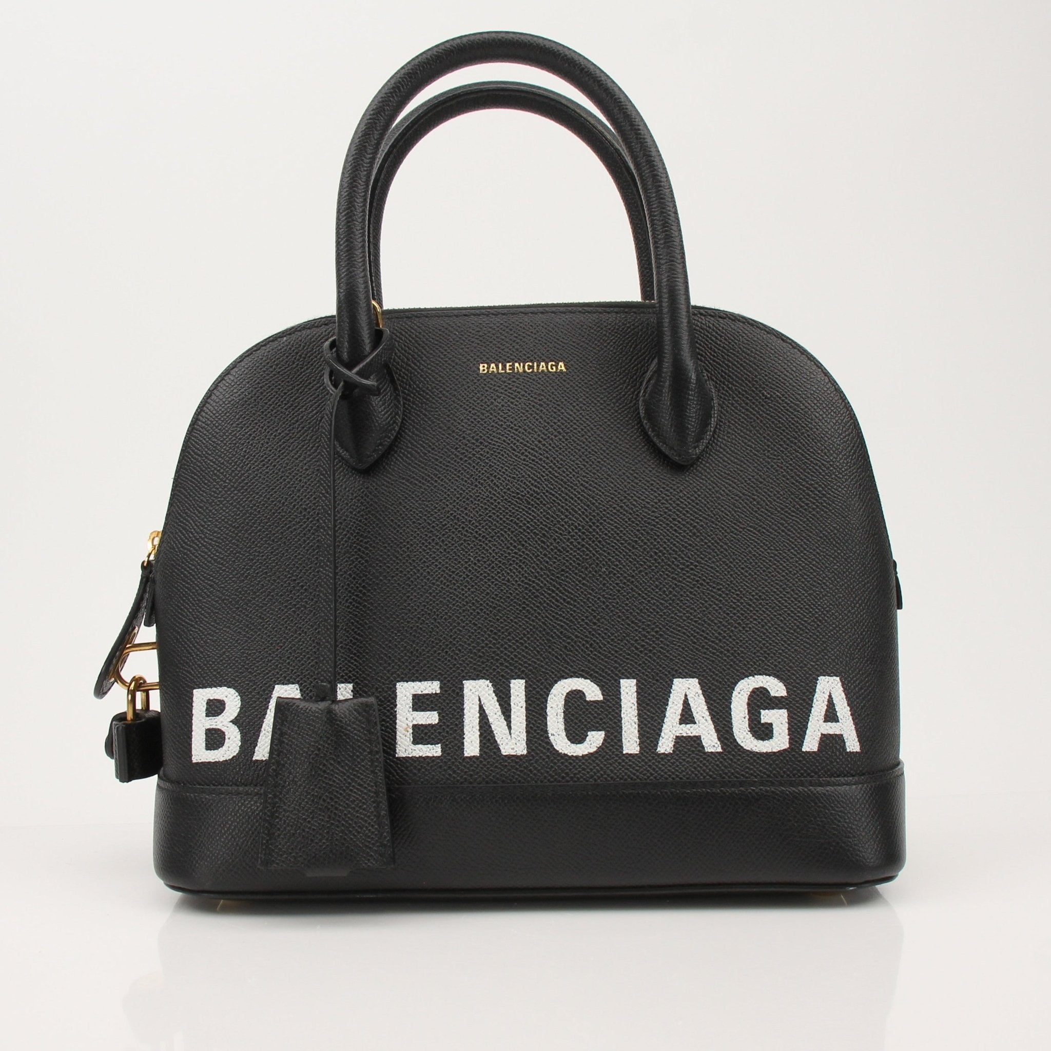 Gold & Beyond Balenciaga Ville Top Handle Bag, stylish handbag with structured design and top handle, in black leather.