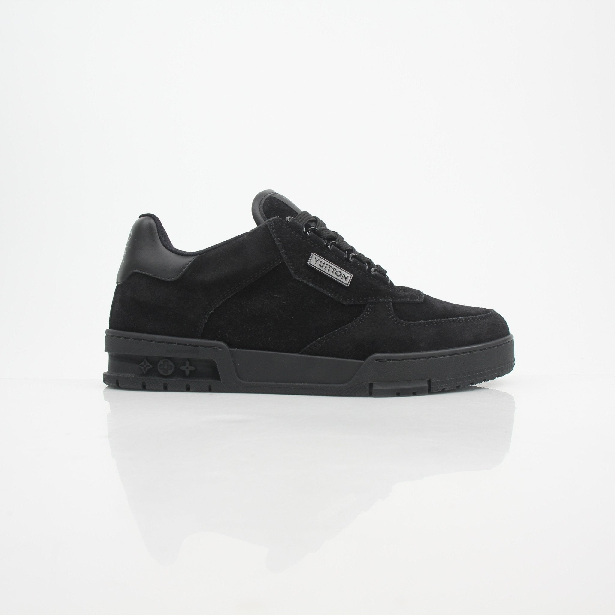 Louis Vuitton Men’s LV Trainer black suede sneakers with white sole and branding details.