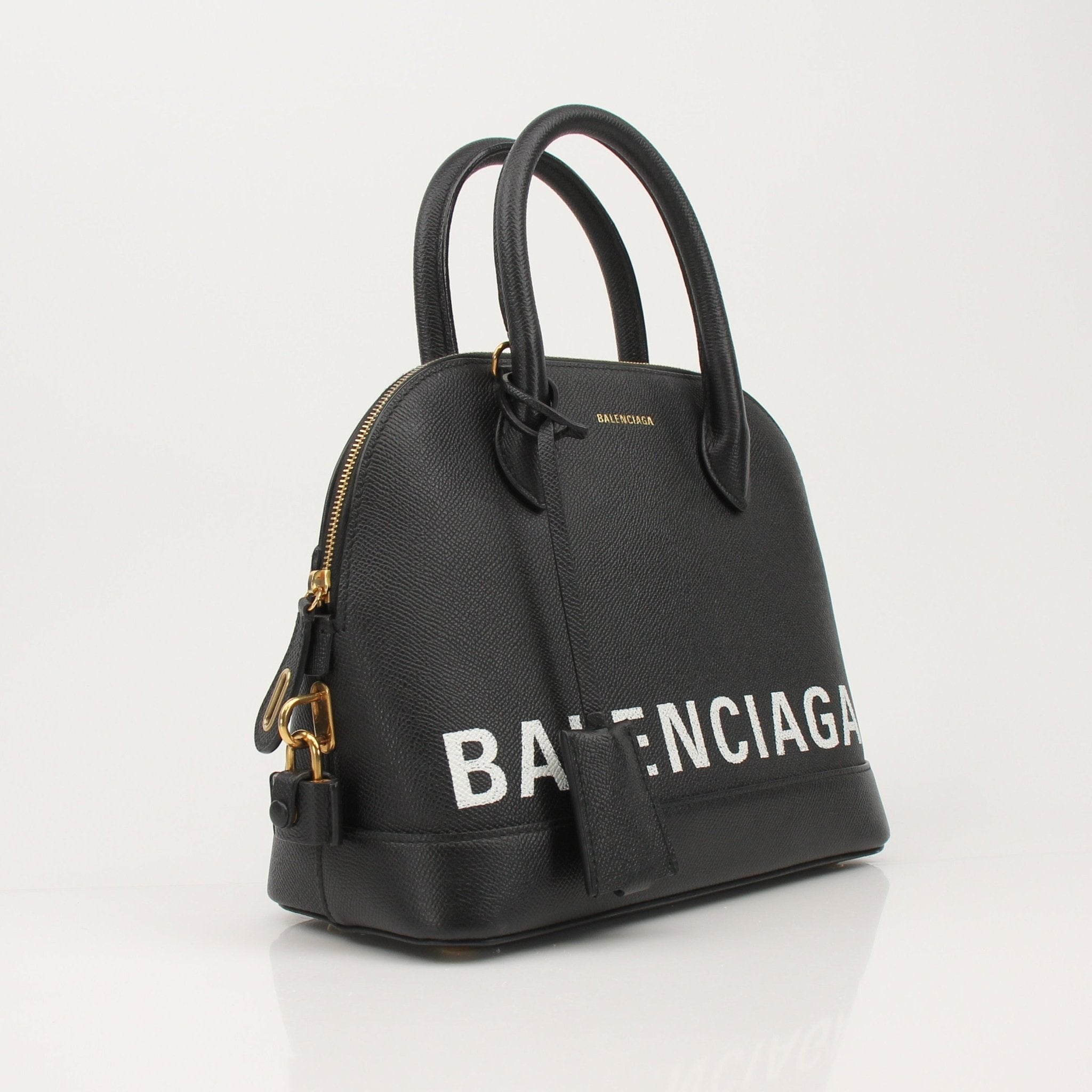 Gold & Beyond Balenciaga Ville top handle handbag with structured design and gold-tone hardware on a white background.
