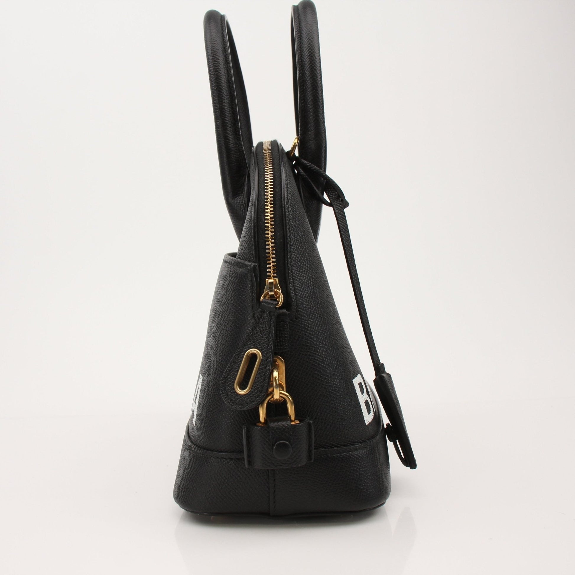 Gold & Beyond Balenciaga Ville top handle handbag with structured design and gold-tone hardware on a clean background.