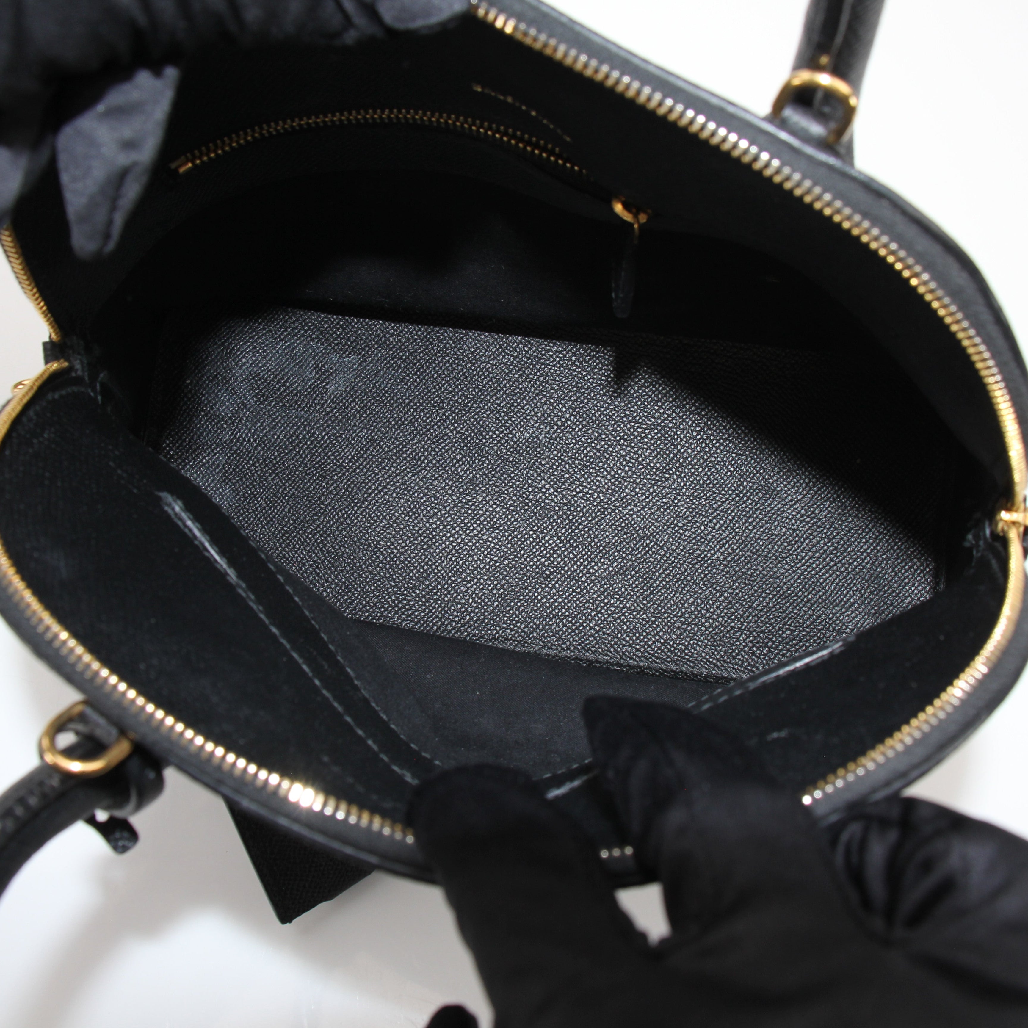 Gold & Beyond Balenciaga Ville top handle handbag with structured design and sleek leather finish.