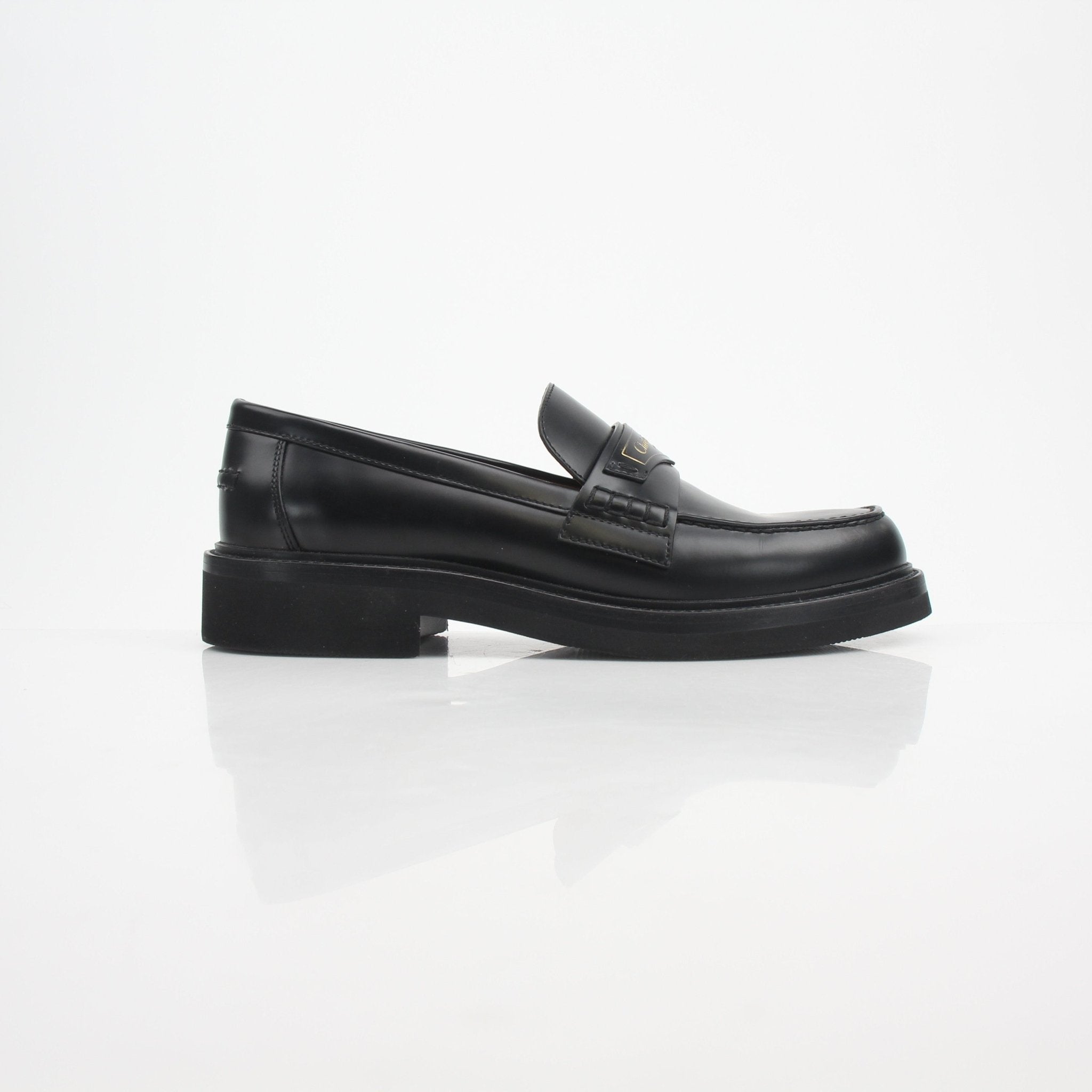 Christian Dior women's Dior Boy brushed calfskin loafers, elegant slip-on shoes with a sleek finish and classic design.