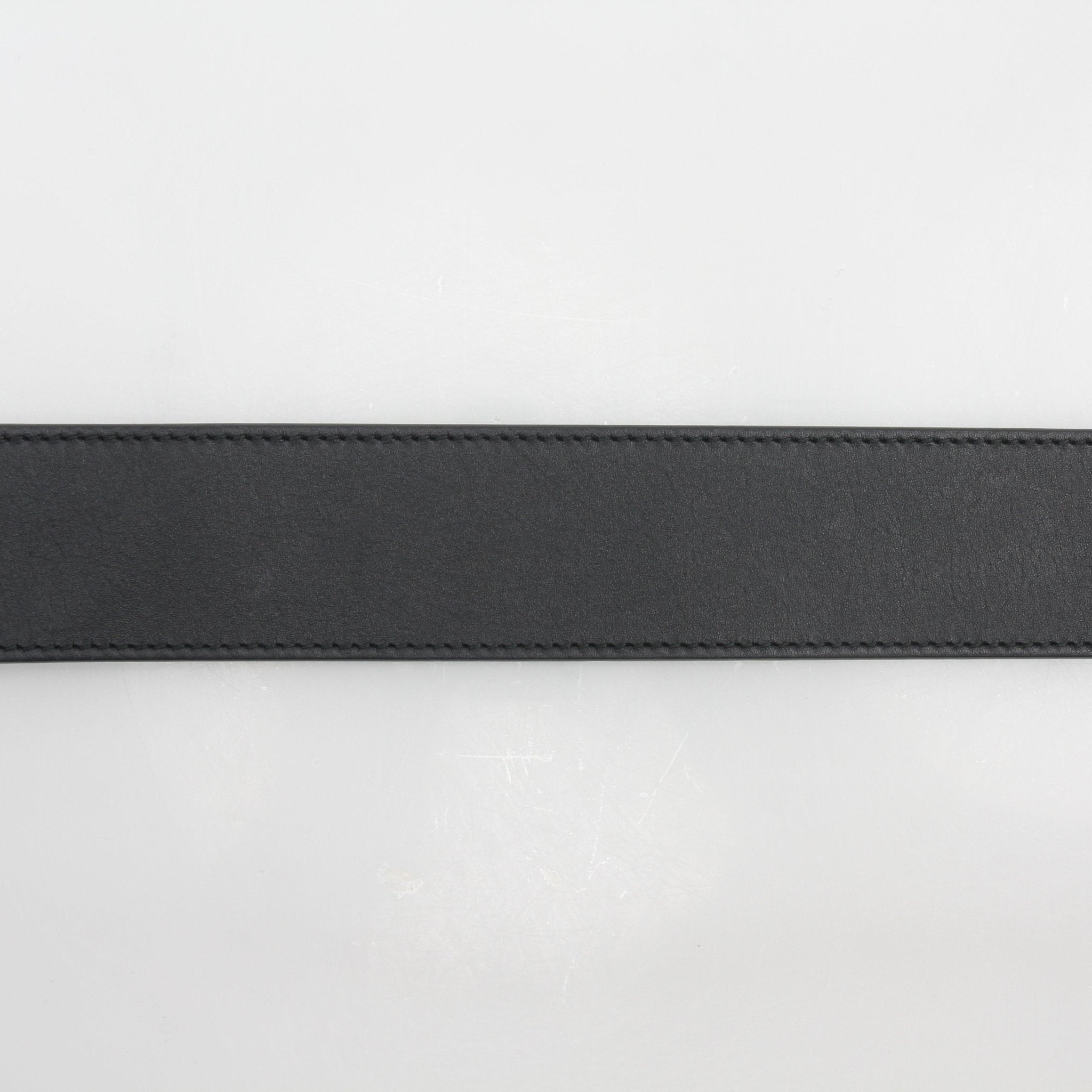 Gucci GG Marmont scales leather belt in size 95/38, featuring gold hardware and signature design, displayed on a neutral background.