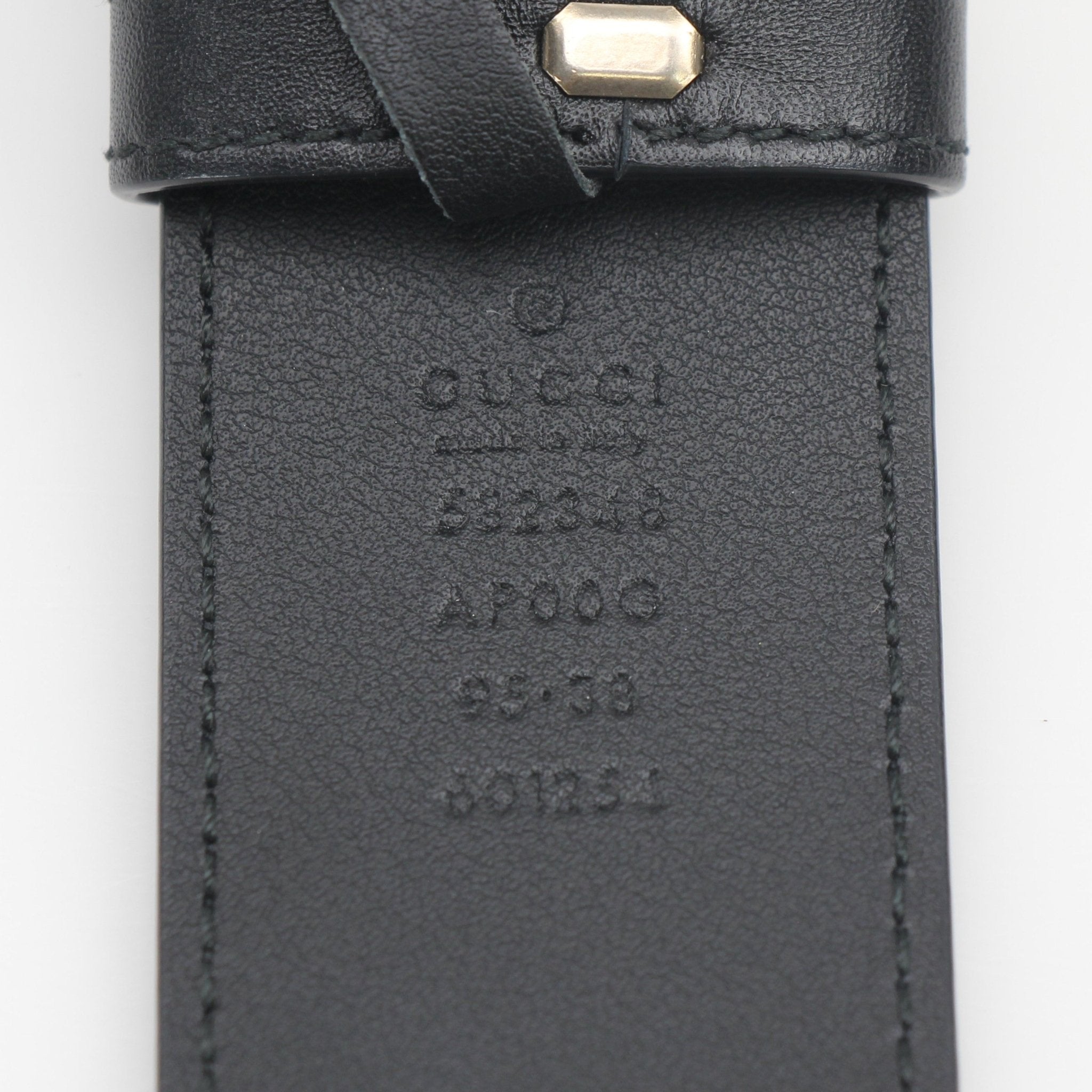 Gucci GG Marmont scales leather belt in size 95/38 featuring gold hardware and textured design, displayed on a neutral background.