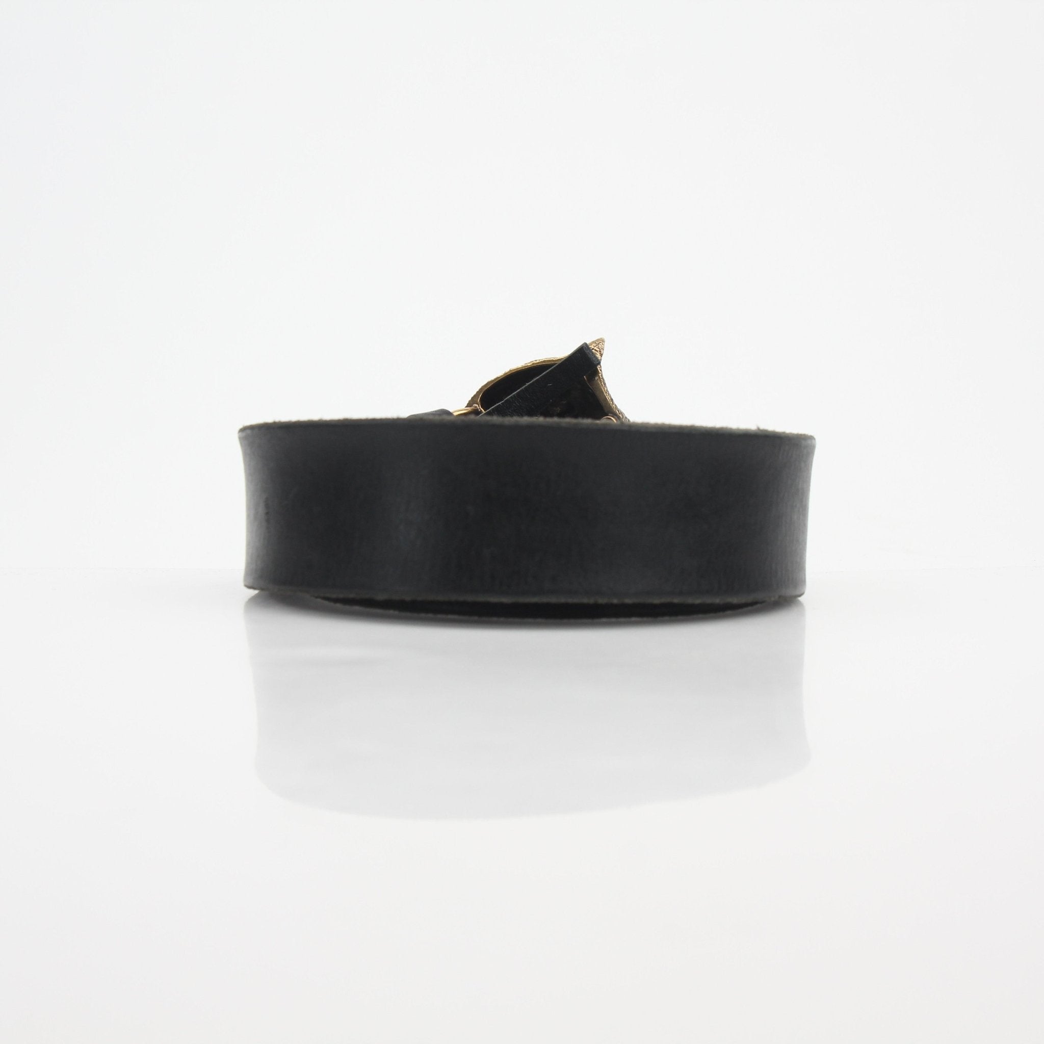 Gucci Feline Head leather belt in black with gold buckle, accessory by Gold & Beyond, showcasing the detailed feline head design.