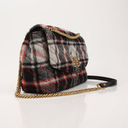 Gold & Beyond Balenciaga BB Chain handbag showing its sleek design, gold chain strap, and structured black leather body.
