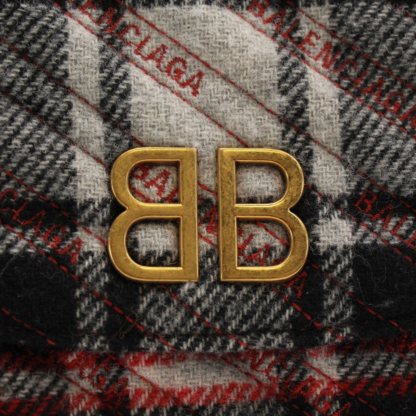Gold & Beyond Balenciaga BB Chain Bag handbag with gold chain strap and logo detail, resting on a neutral background.