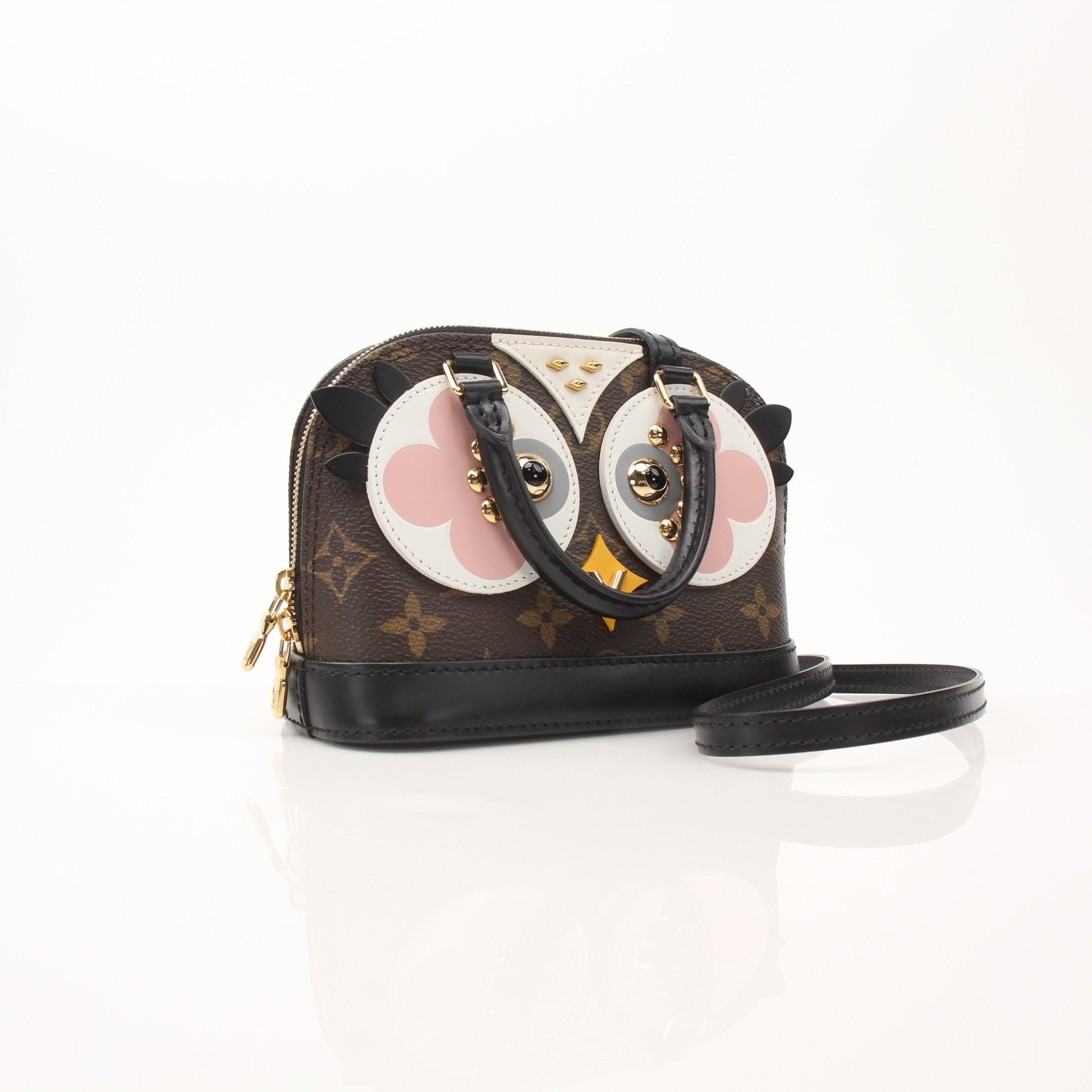 Louis Vuitton Lovely Birds Nano Alma handbag in leather with bird pattern and gold hardware, black strap, and compact design.