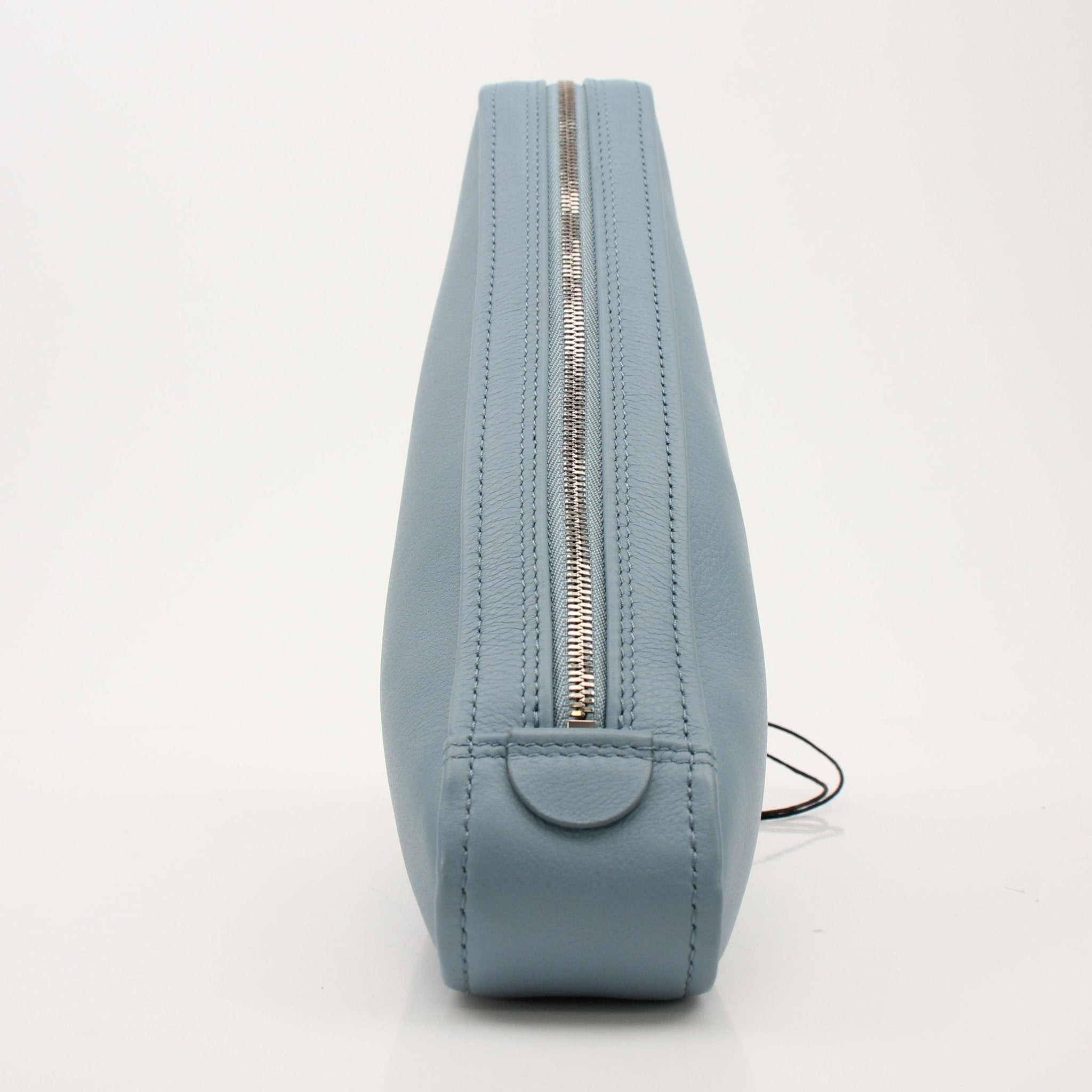 Gold & Beyond Balenciaga Triangle Pouch handbag with sleek design and signature logo, shown in a close-up image.