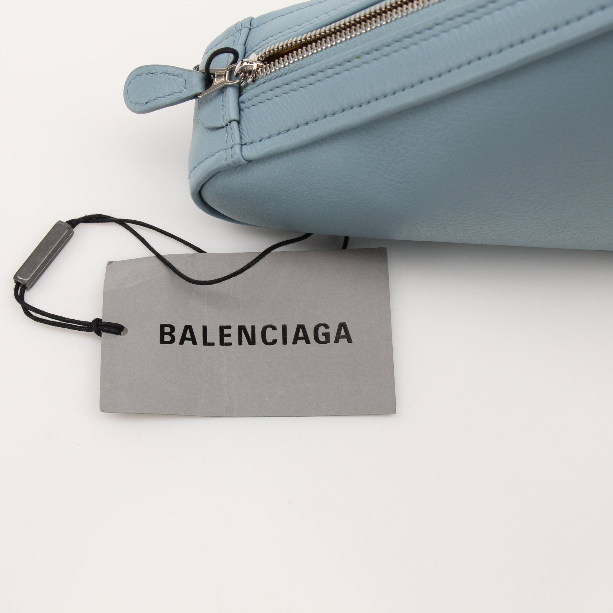 Gold & Beyond Balenciaga Triangle Pouch handbag with sleek design and signature logo, featuring a compact, stylish accessory.