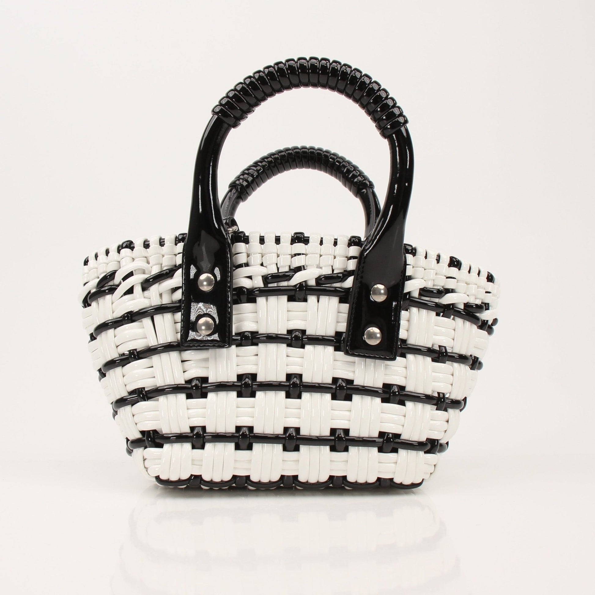 Balenciaga Bistro Basket handbag with woven design, leather handle, and structured shape, showcasing luxury fashion style.