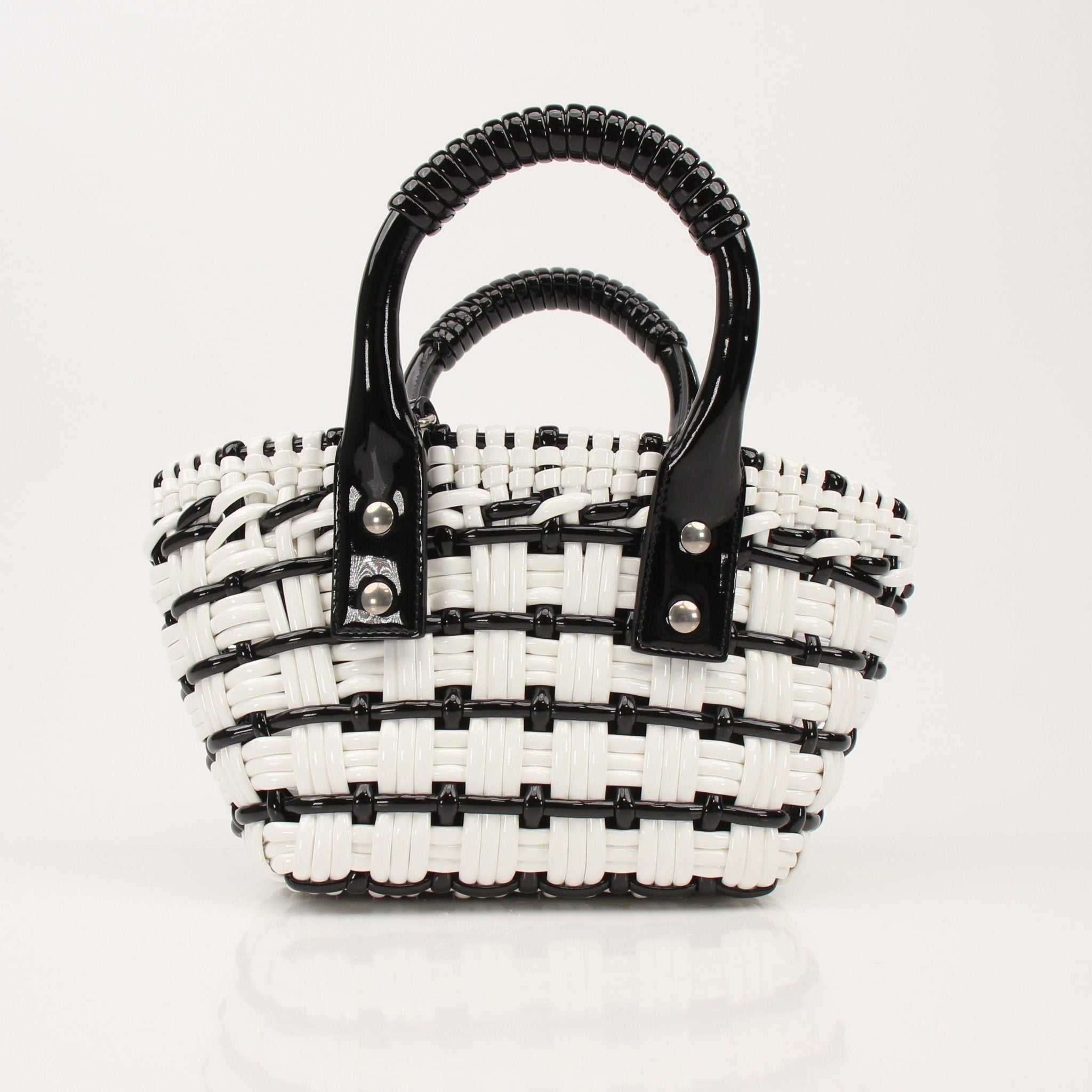 Balenciaga Bistro Basket handbag with woven design, leather handle, and structured shape, showcasing luxury fashion style.