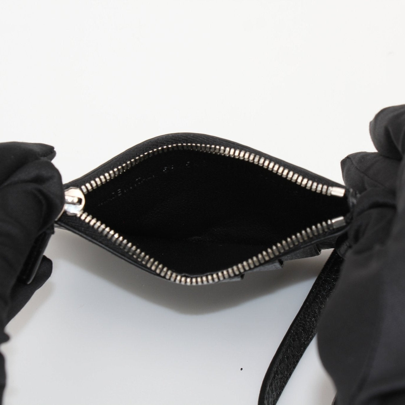 Gold & Beyond Balenciaga wallet with strap, stylish cardholder featuring multiple card slots and sleek design.