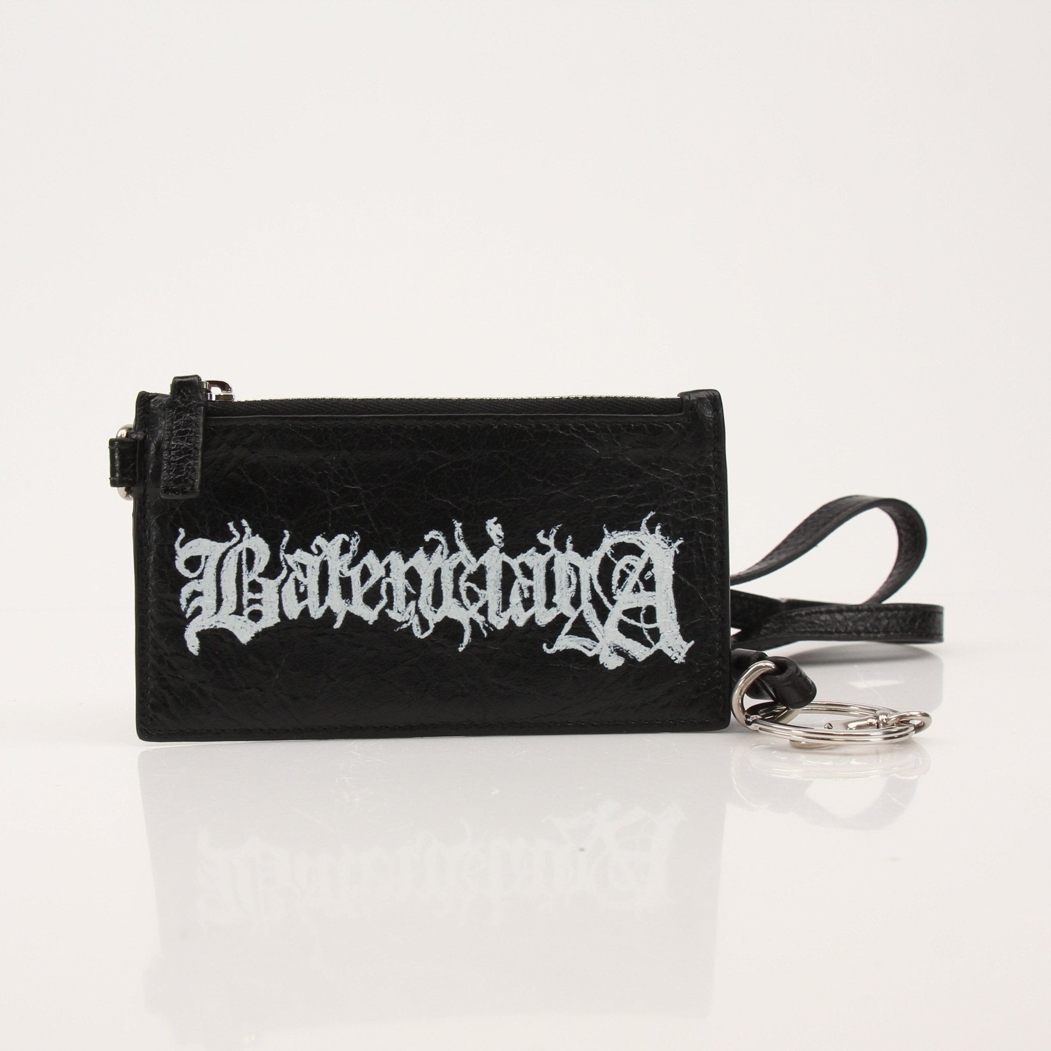Gold & Beyond Balenciaga cardholder wallet with strap, featuring sleek design and multiple card slots.