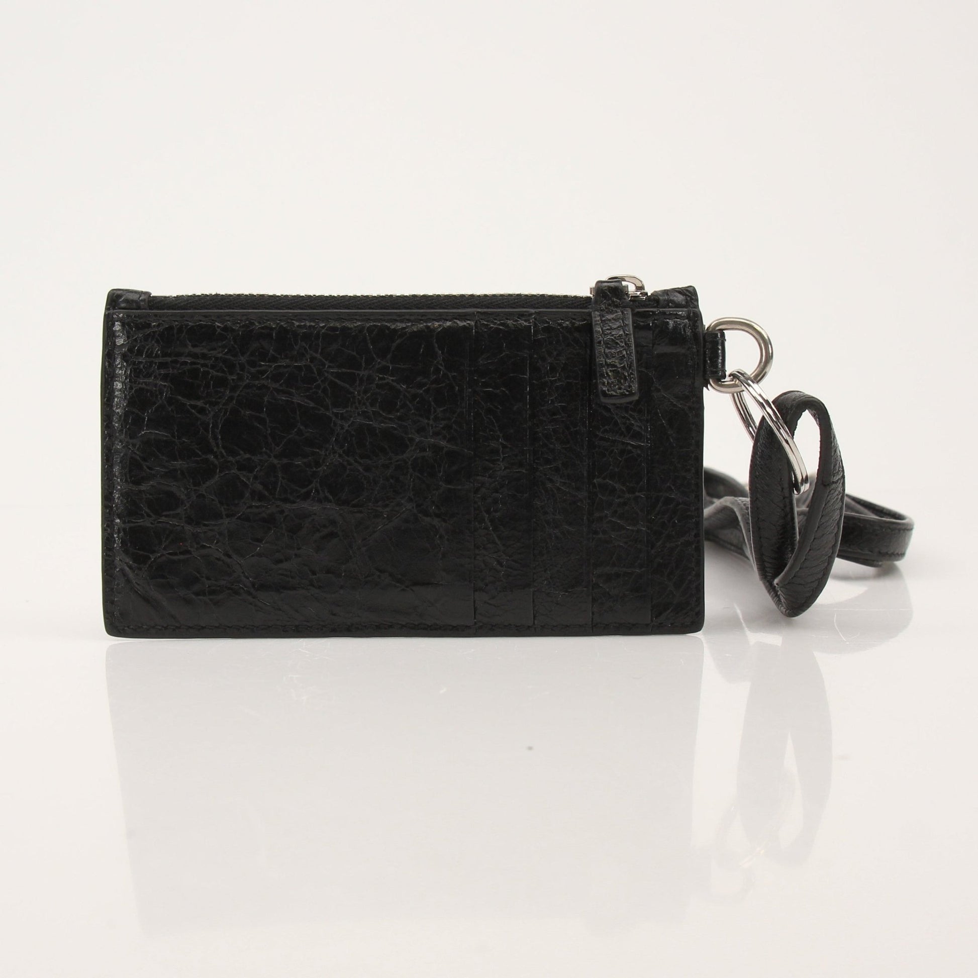 Gold & Beyond Balenciaga leather cardholder with strap, compact wallet with multiple card slots and strap attachment.