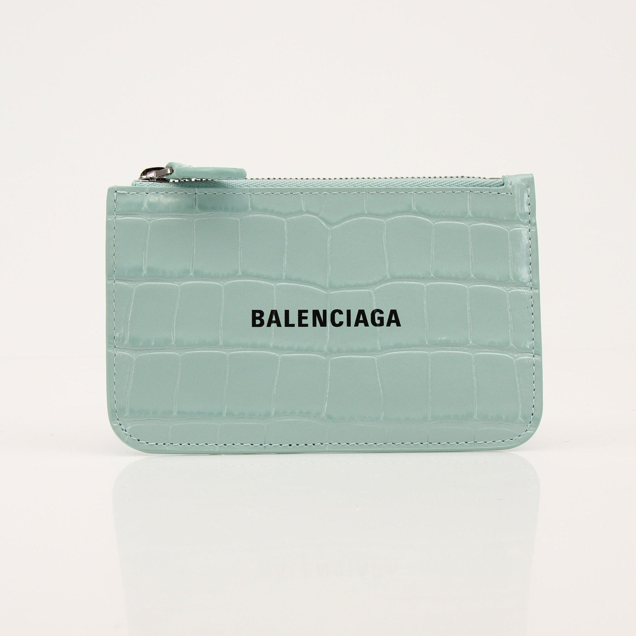 Gold & Beyond Balenciaga card holder wallet with multiple card slots and sleek design, showcased on a neutral background.