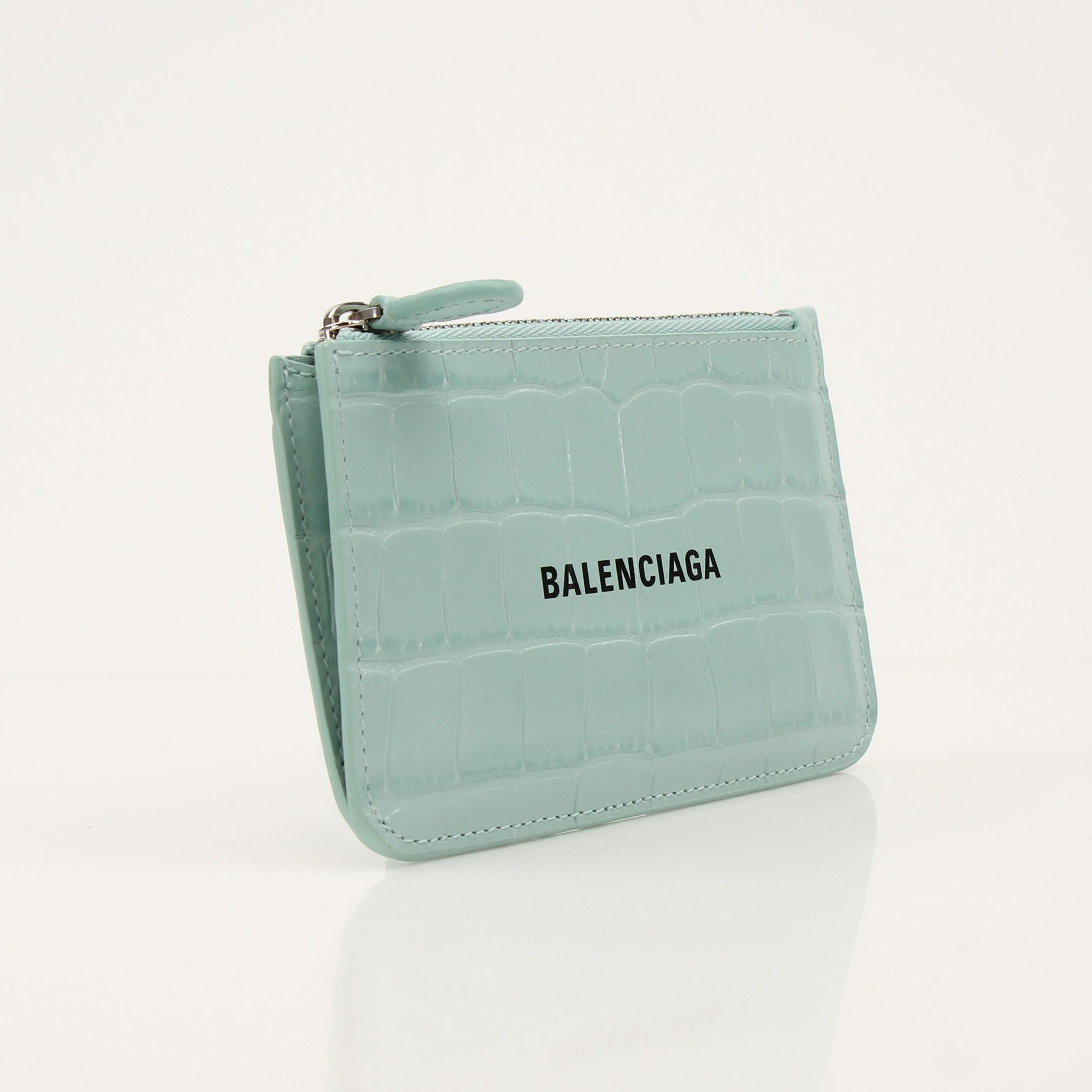 Gold & Beyond Balenciaga card holder wallet with sleek design and multiple card slots, displayed on a neutral background.