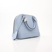 Blue Louis Vuitton Nuage Alma BB handbag with gold accents, featuring smooth leather and structured design.