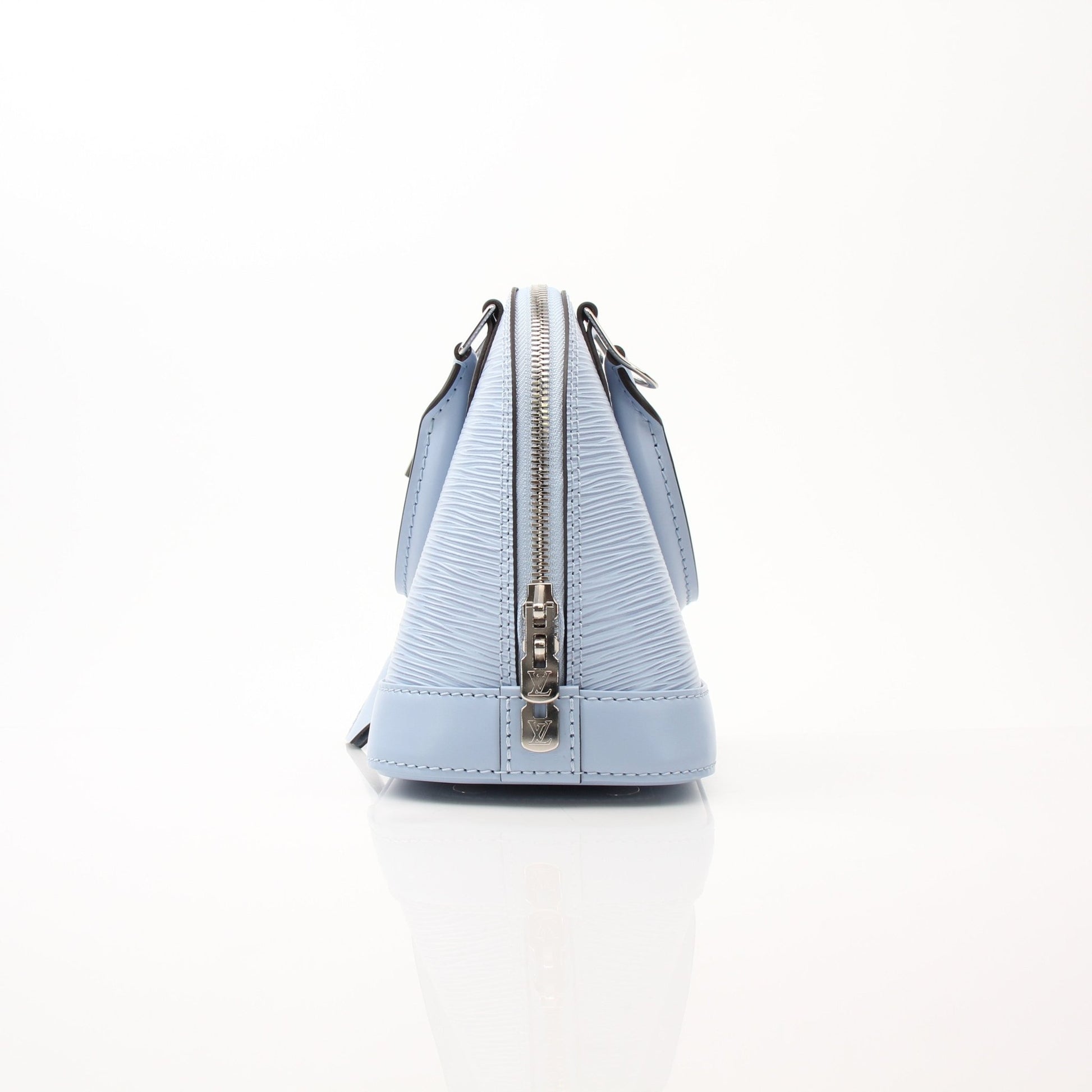 Louis Vuitton Blue Nuage Alma BB handbag with gold accents, featuring structured leather and elegant design.
