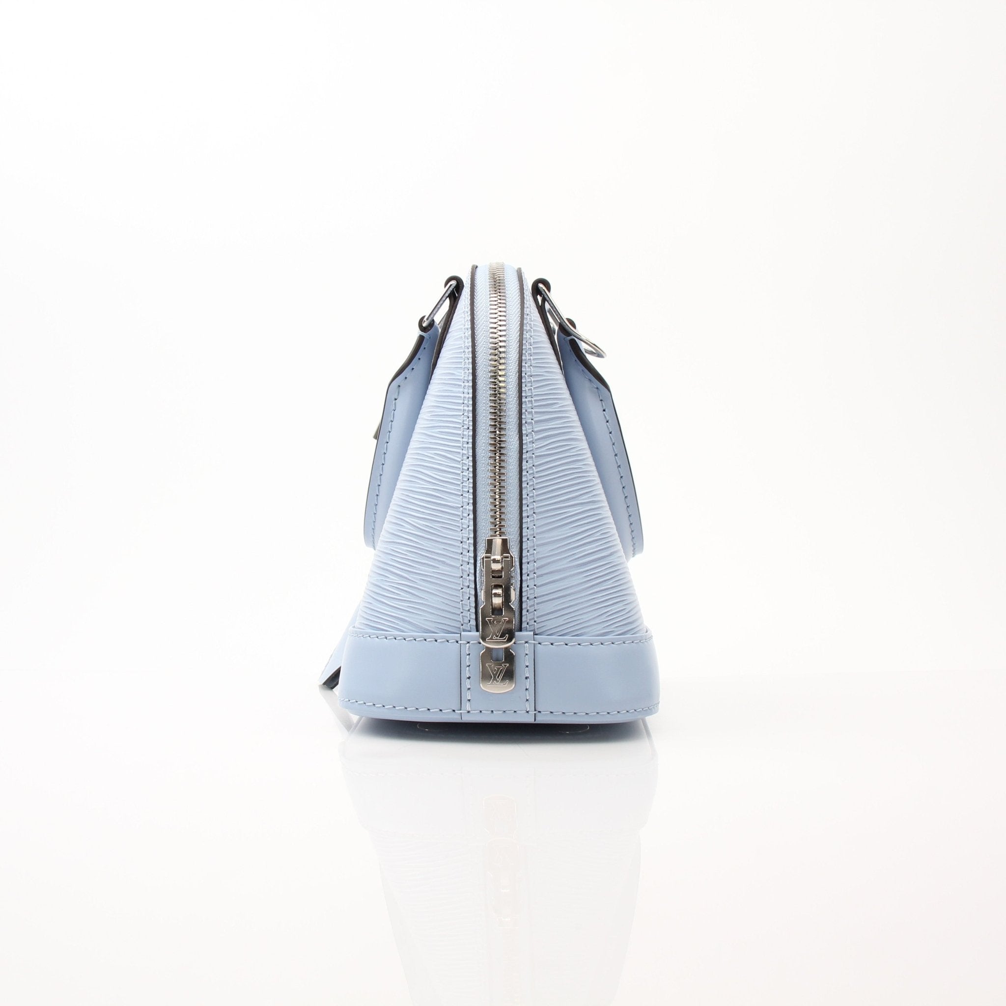 Louis Vuitton Blue Nuage Alma BB handbag with gold accents, featuring structured leather and elegant design.