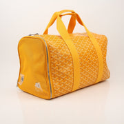 Gold & Beyond Goyard Voltiguer dog carrier travel bag with top handle and side pocket for pet transportation.