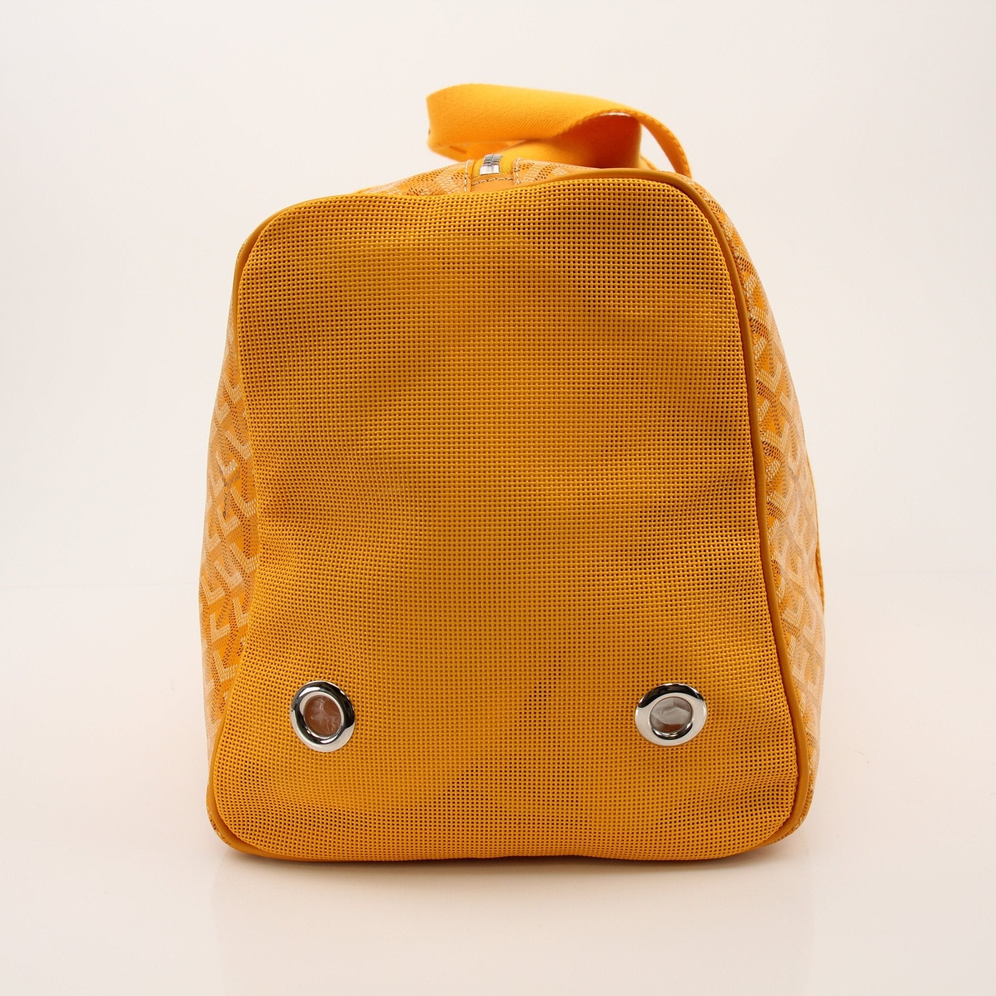 Goyard Voltiguer dog carrier travel bag by Gold & Beyond, stylish and spacious with leather accents and top handles.