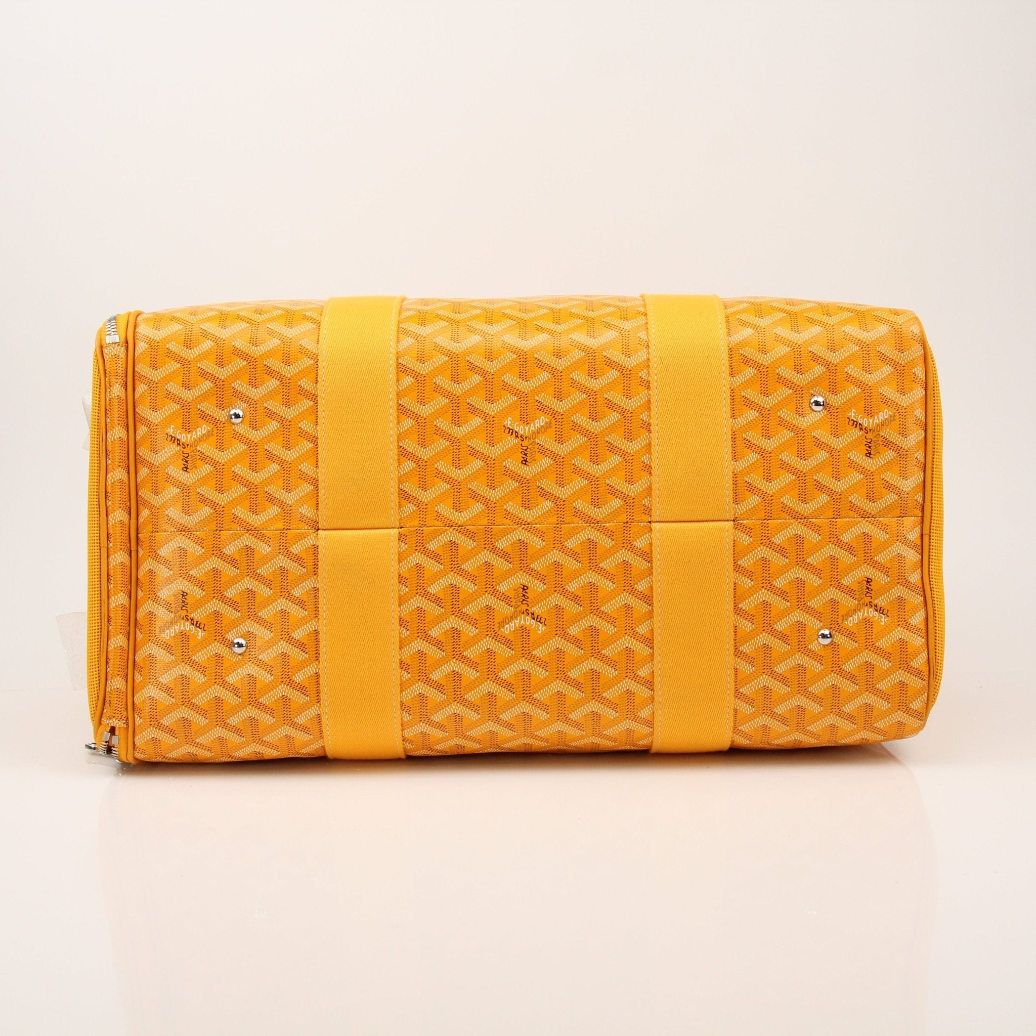 Gold & Beyond Goyard Voltiguer dog carrier travel bag with sleek design and sturdy handles, ideal for pet travel and comfort.