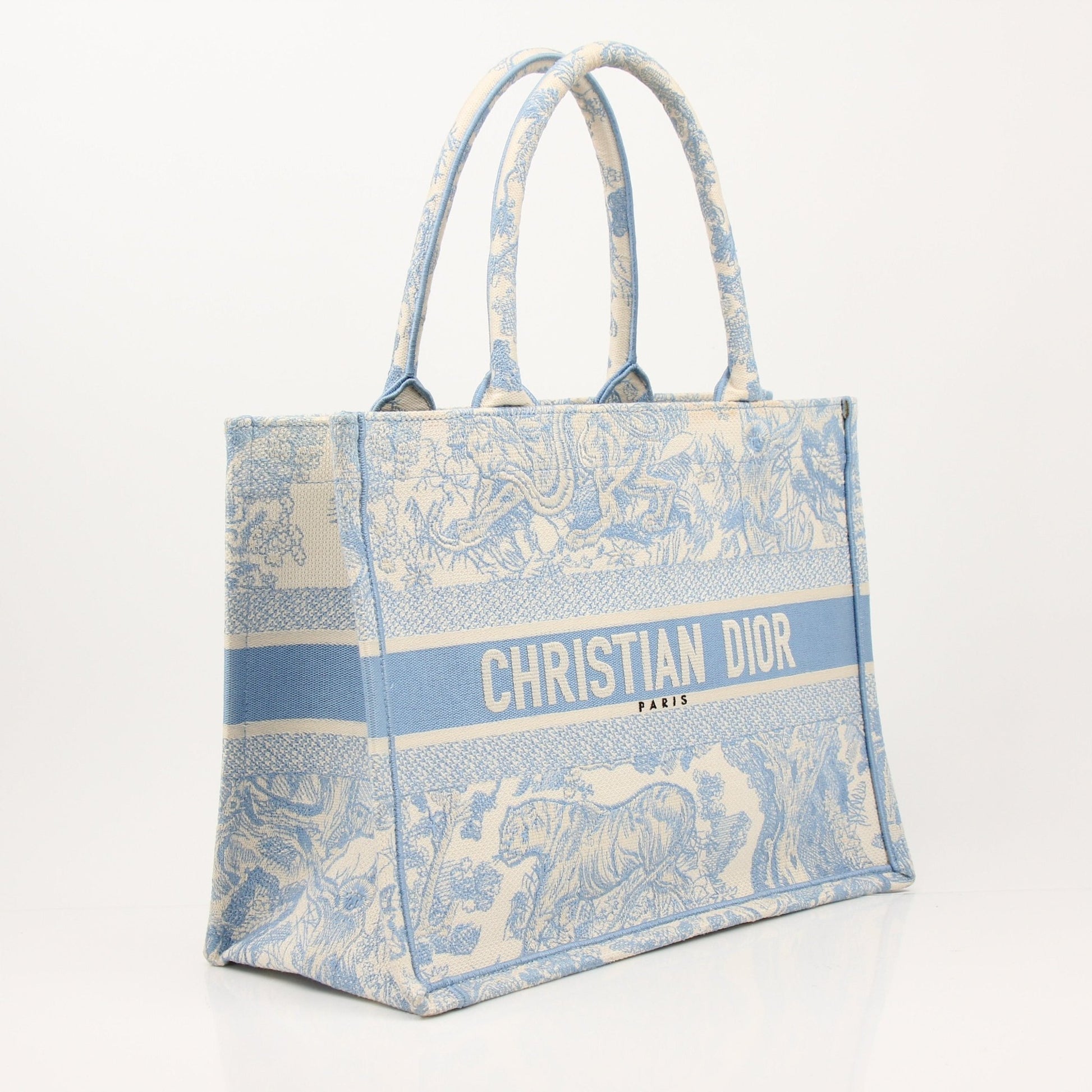 Christian Dior Book Tote handbag with gold accents, featuring the signature Dior design and spacious interior.